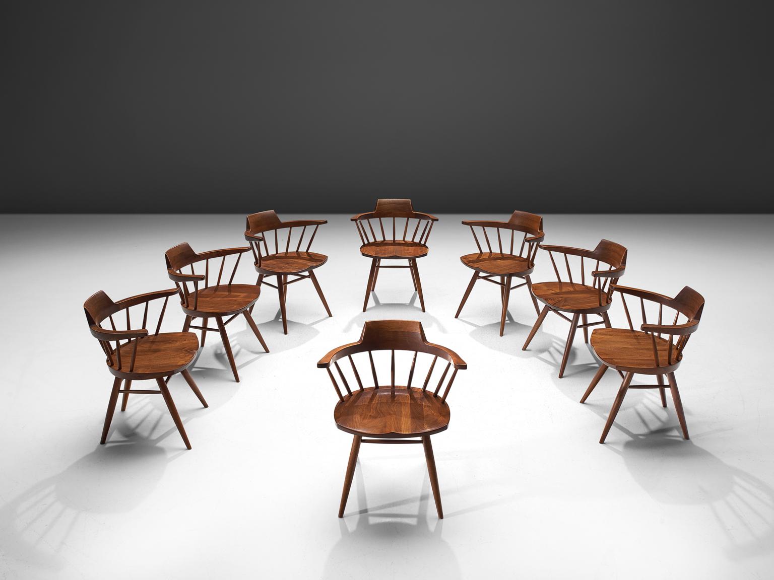 George Nakashima, set of eight 'Captain' chairs, walnut, New Hope, PA, 1974.

This set of Captain chairs is designed by George Nakashima. It is not often that we come across a set that is eight pieces large. The captain chairs, executed in black