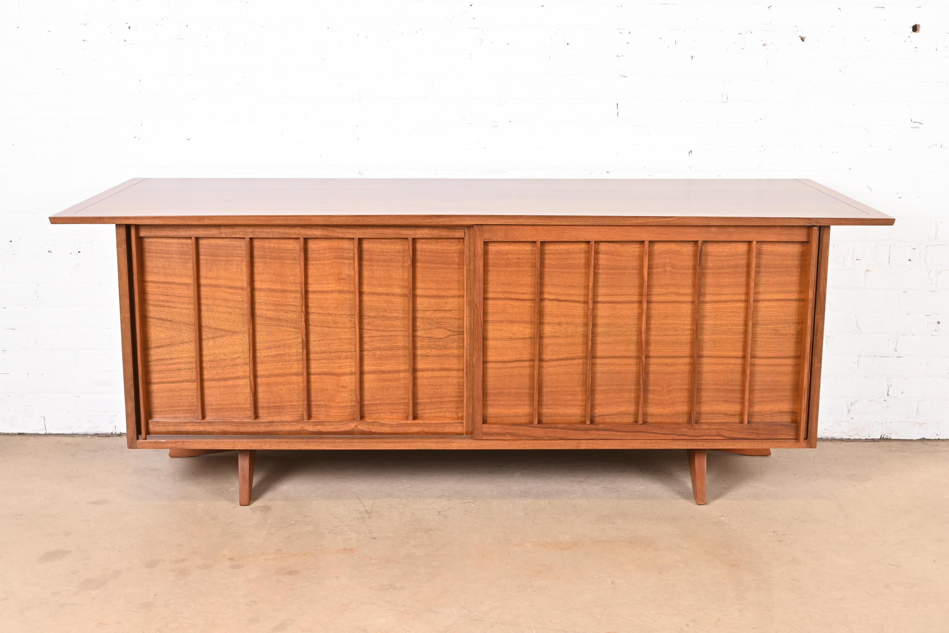 A very rare and exceptional mid-century Organic Modern sliding door sideboard, credenza, or bar cabinet

By George Nakashima for Widdicomb Furniture, 