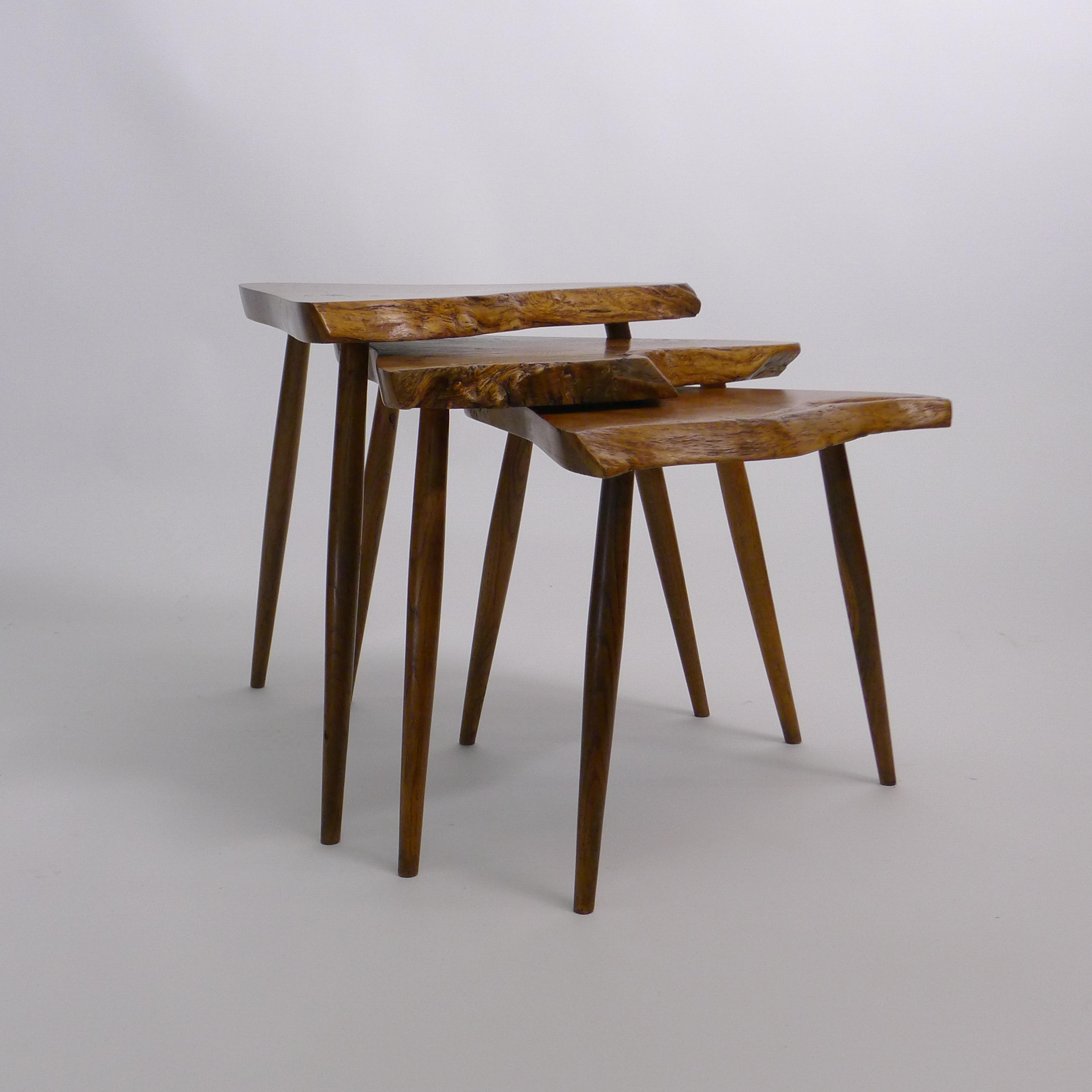 George Nakashima
Set of Three Amoeba nesting tables
Nakashima Studio, USA, 1960
oak burl, oak
with free edges to the triangular tops, each on three turned legs
the smallest table inscribed with client's name to underside
accompanied by a digital