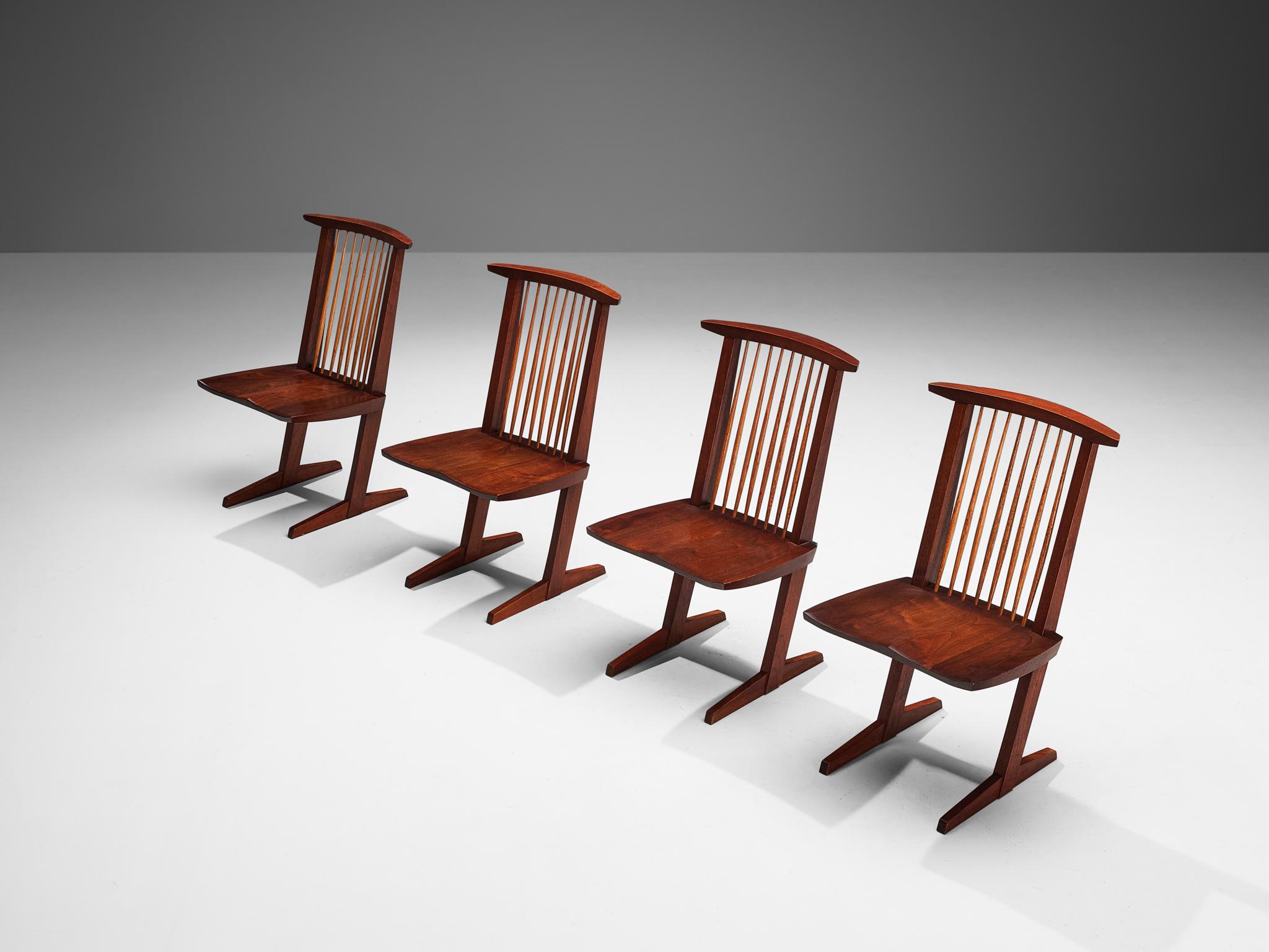 George Nakashima for Nakashima Studio, set of four 'Conoid' chairs, walnut, hickory, United States, 1962

This stunning set of four Conoid dining chairs are designed by woodwork master George Nakashima and made in 1962. The most striking feature of