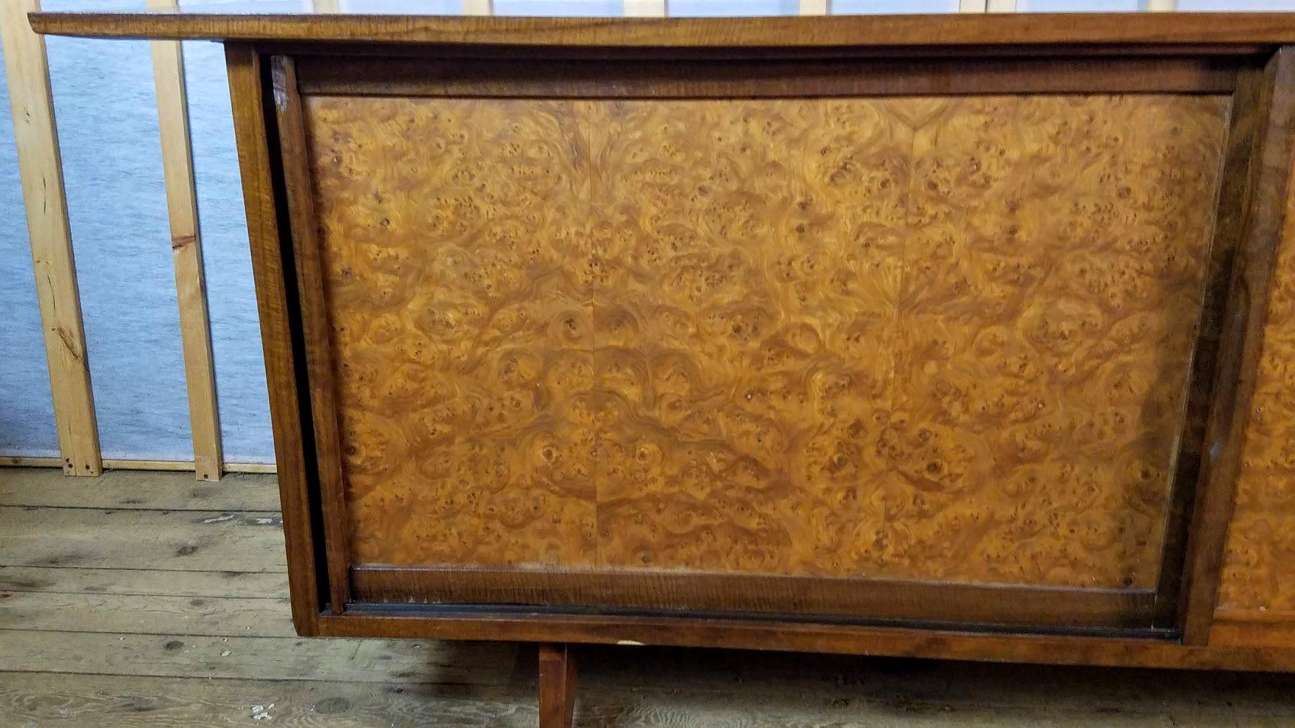 George Nakashima sideboard Model 205 manufactured in 1961 by the Widdicomb Furniture Company of Grand Rapids, Michigan as part of his Origins line of furniture produced between 1959-1963.
The sideboard is signed, stamped, labeled and dated.
The