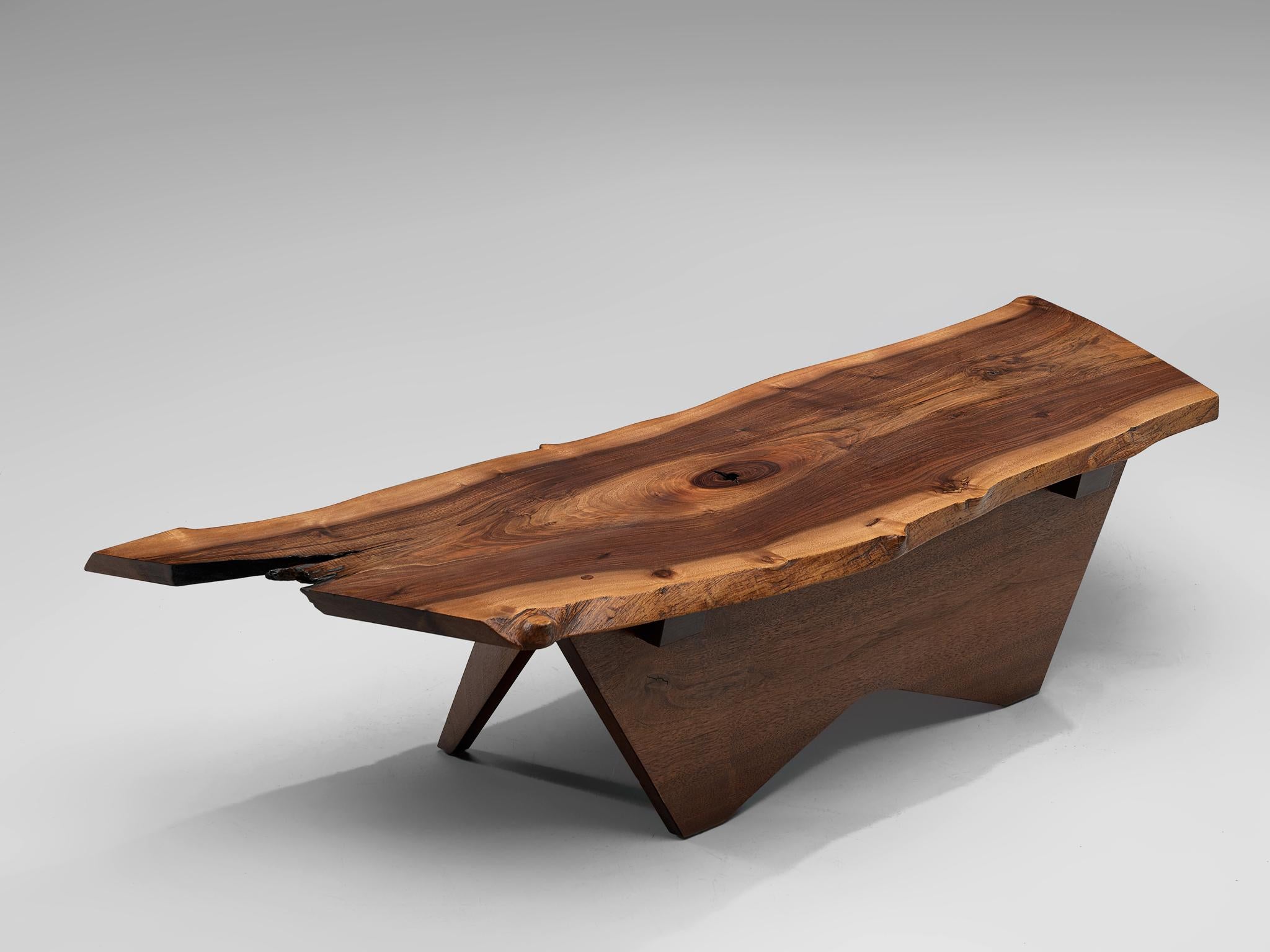 George Nakashima, Slab coffee table, American walnut, United States, 1958 or 1962

A slab coffee table made of a solid board top of black American walnut. The coffee table is designed to express the character of a particular slab. The top features