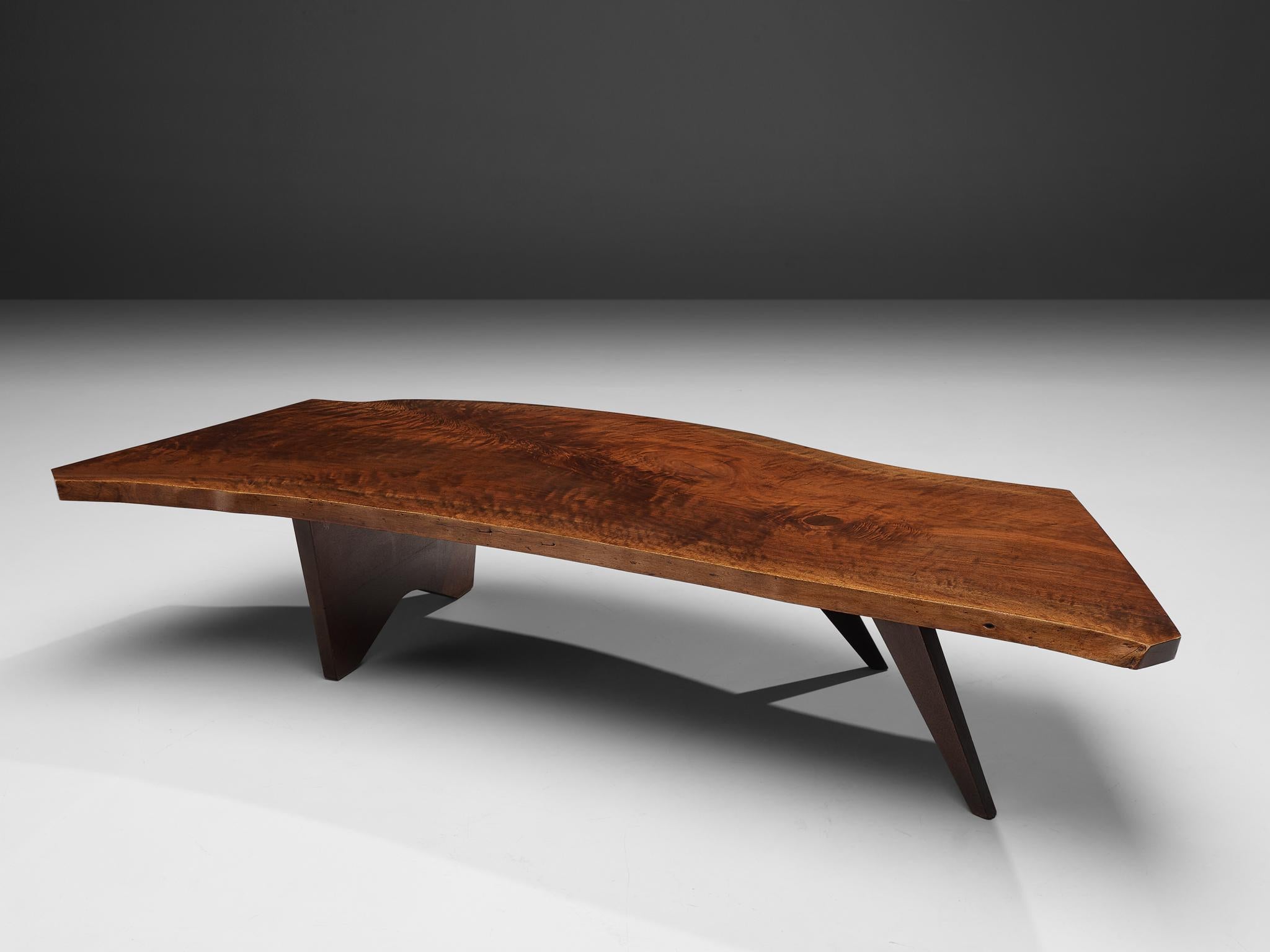 George Nakashima, slab coffee table, American walnut, United States, 1960s

A slab coffee table made of a solid board top. The coffee table is designed by George Nakashima ands expresses the character of a particular slab. The top features two