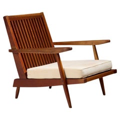 Chaise longue 'Cushion' à dossier fuseau George Nakashima en cerisier noir américain