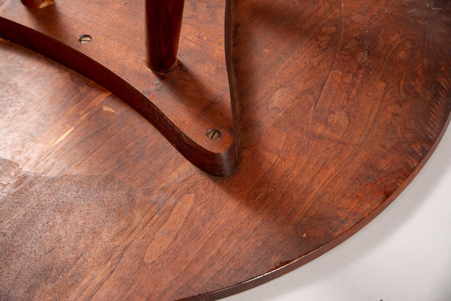 Round, splayed leg, hand-honed side table by George Nakashima, circa early 1950s. Original owner purchased this table directly from Nakashima in 1950s in PA studio. It appears to be walnut with nice grain patterns and has three tapered legs.