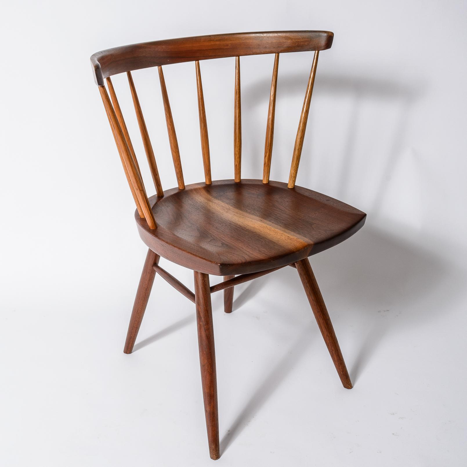 George Nakashima Straight Back Chair
Walnut and Hickory Construction
Single Board carved Sap Grained Seat
Signed George Nakashima to underside of chair Seat