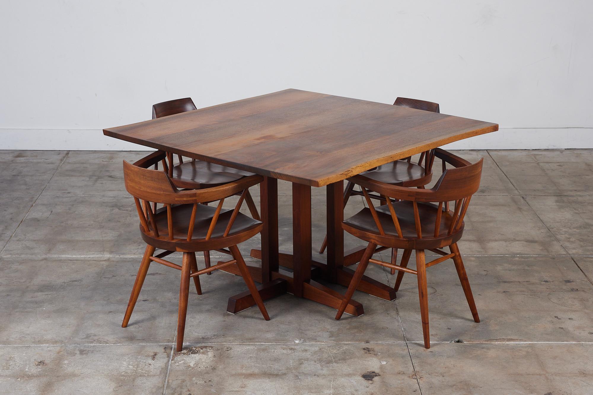 Mid-Century Modern George Nakashima Studio Dining Set featuring Black Walnut Captain Chairs
