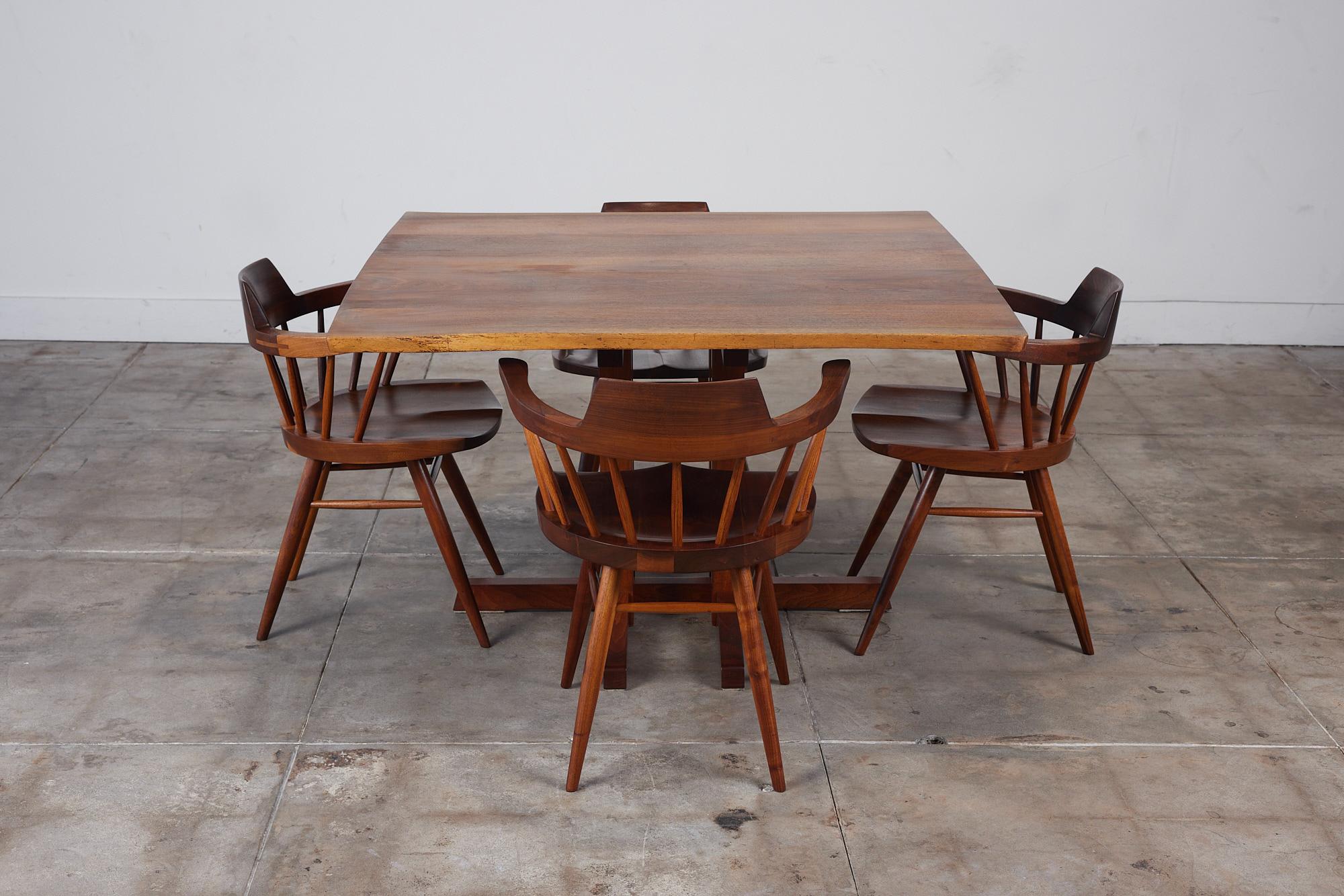 George Nakashima Studio Dining Set featuring Black Walnut Captain Chairs In Excellent Condition In Los Angeles, CA