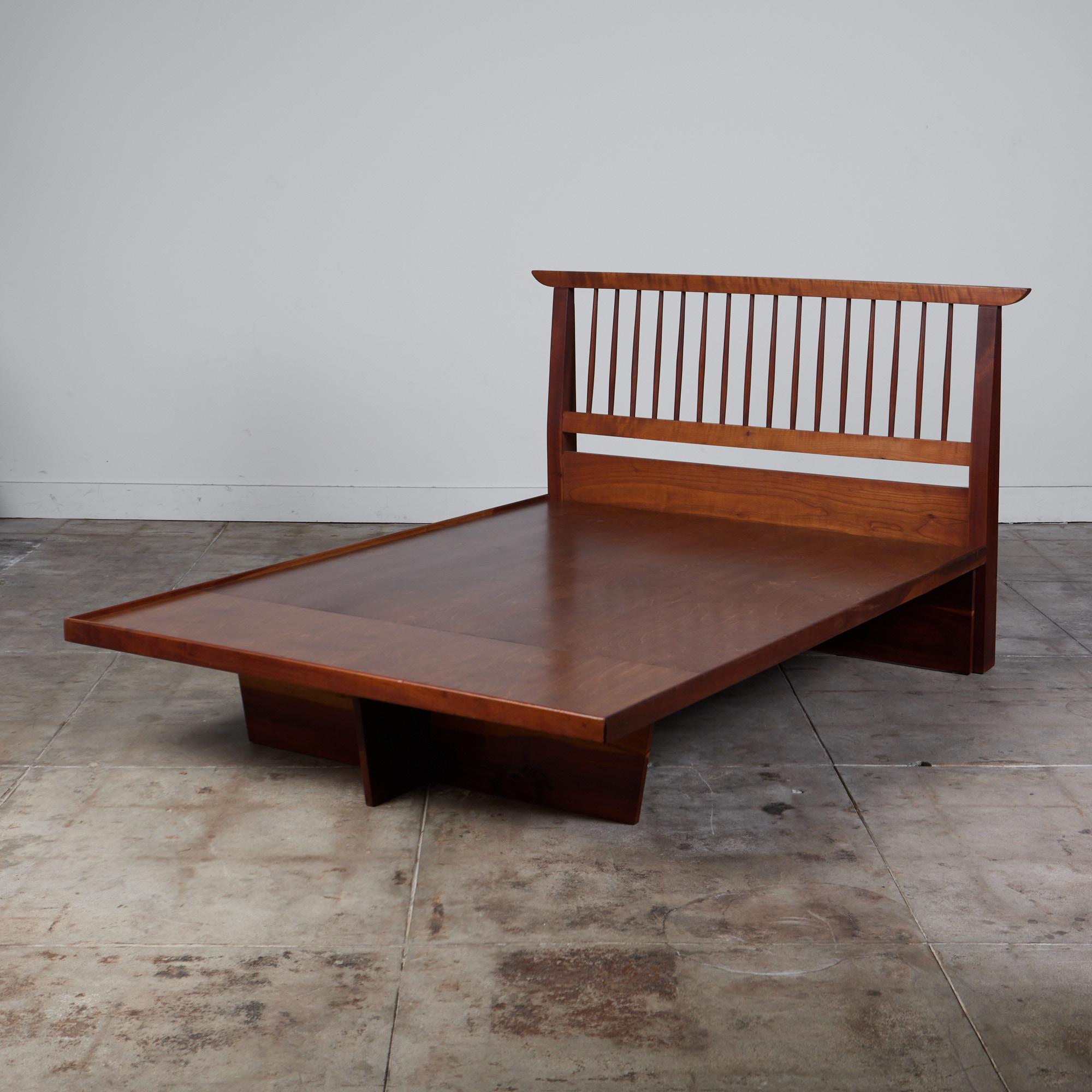 Platform bed by George Nakashima. This frame made from solid black walnut features a spindle headboard and platform base for a full size mattress.

Base has been modified by previous owner. Original base was a full box
