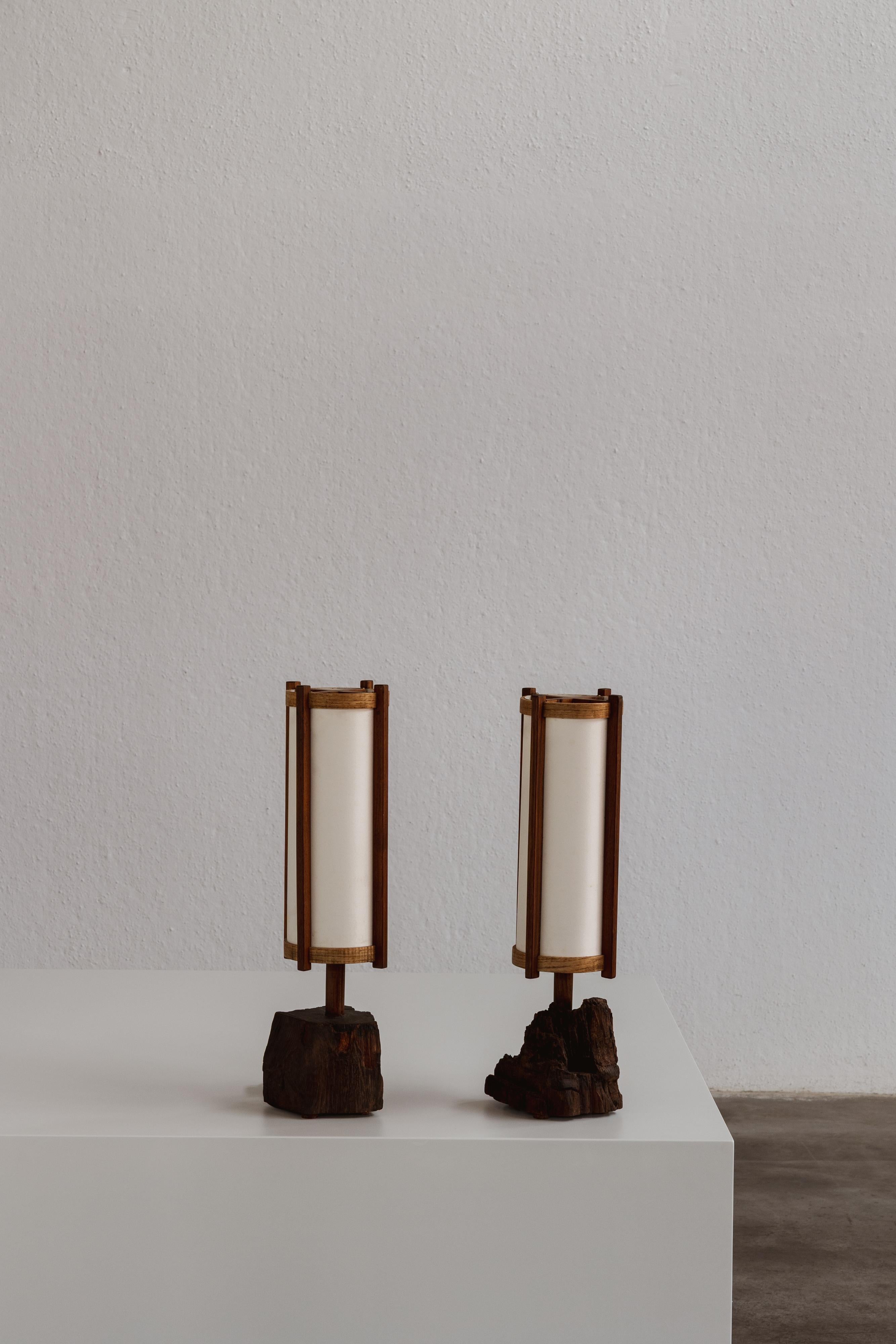 George Nakashima table lamps, walnut and fabric, USA, 1961, set of two.

George Nakashima, the renowned American artist and sculptor born from a Japanese family in Spokane, WA, crafted this pair of table lamps in his workshop in 1961. The vertical