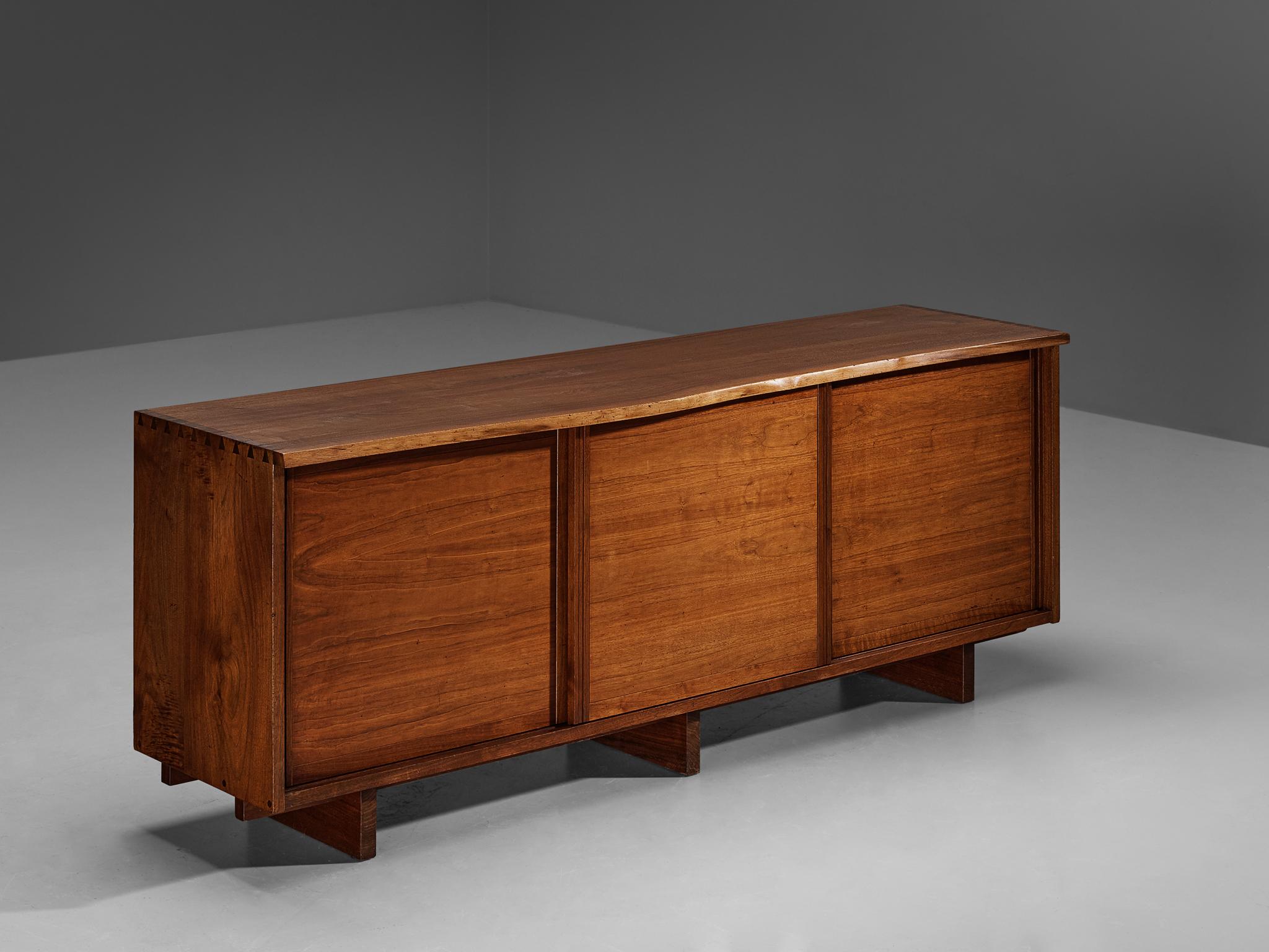 George Nakashima, sideboard, American black walnut, United States, 1961

With regard to its essential form, material use, and woodwork, this triple-sliding door cabinet is a testimony to George Nakashima's expert craftsmanship and distinctive