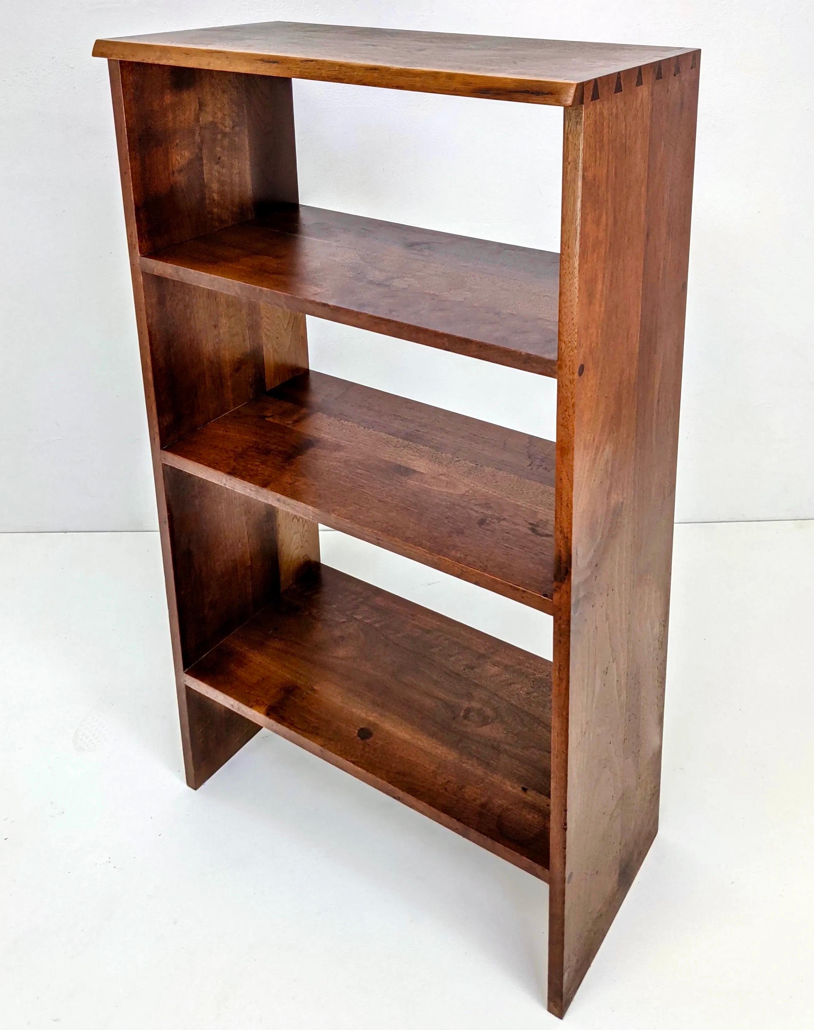 George Nakashima walnut bookcase shelving, free edge, 1960s. American walnut bookcase, free edge walnut top and corner dovetail details.  Nakashima’s belief was that when you made furniture, you created a new life for a tree. His work showcases the