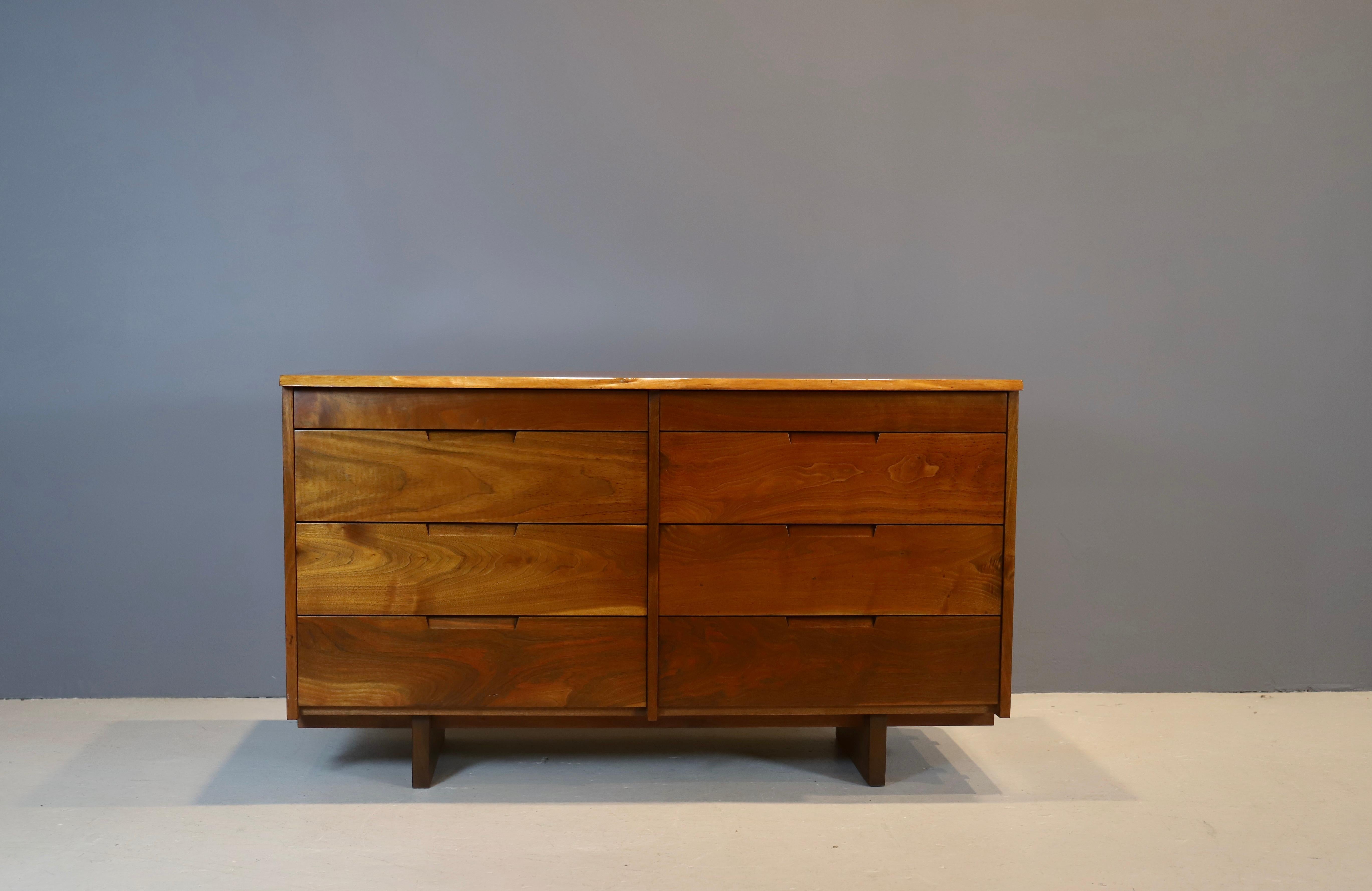 Black American walnut chest of drawers by studio artist George Nakashima, circa 1960s, New Hope, PA.
Chest features 8 drawers and live edge top. Warm patina through - out.
Chest has been cleaned and oiled as per Nakashima studio instructions.
Ne