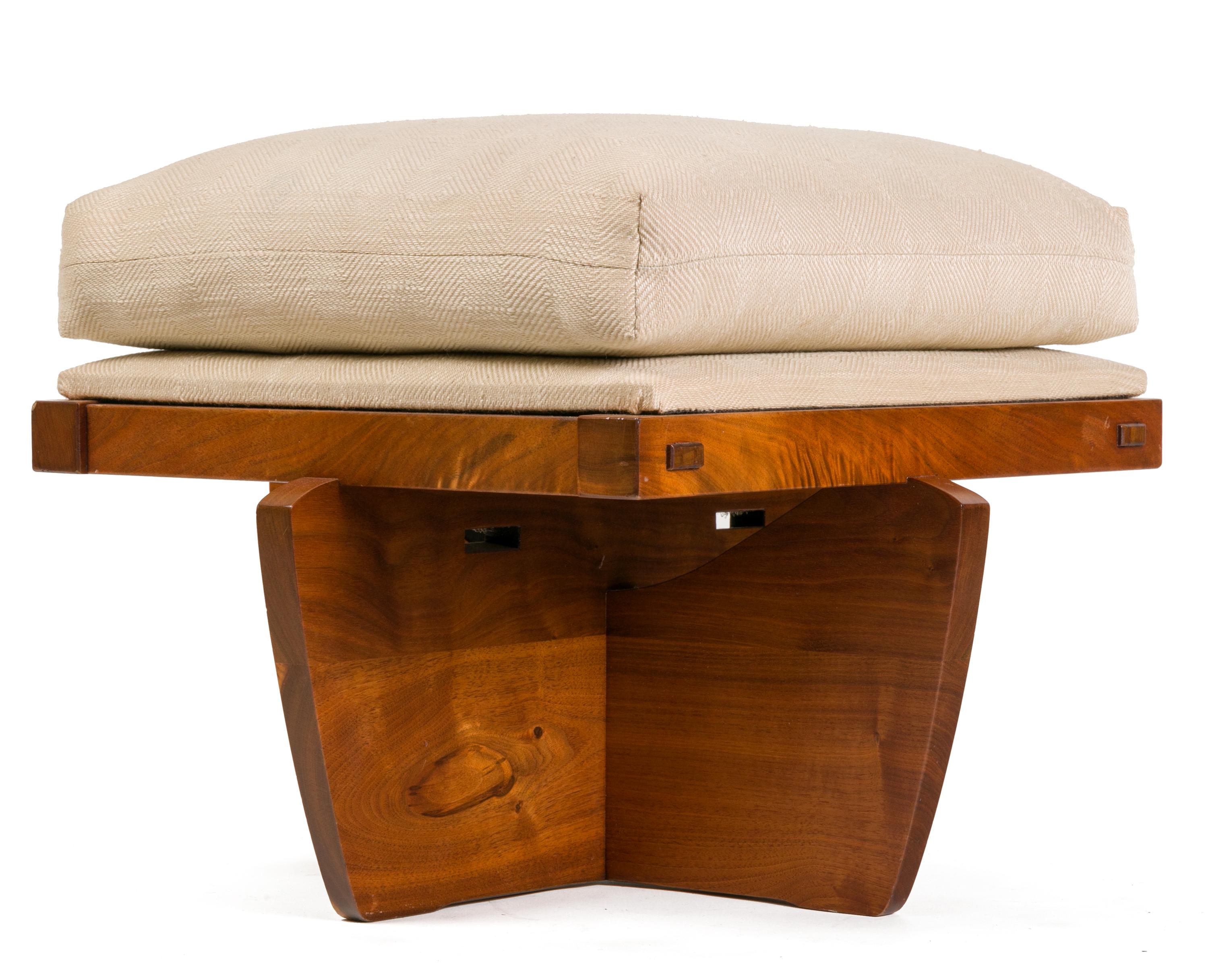 Rare and wonderful these ottoman/stools have Nakashima's very distinctive Conoid base.