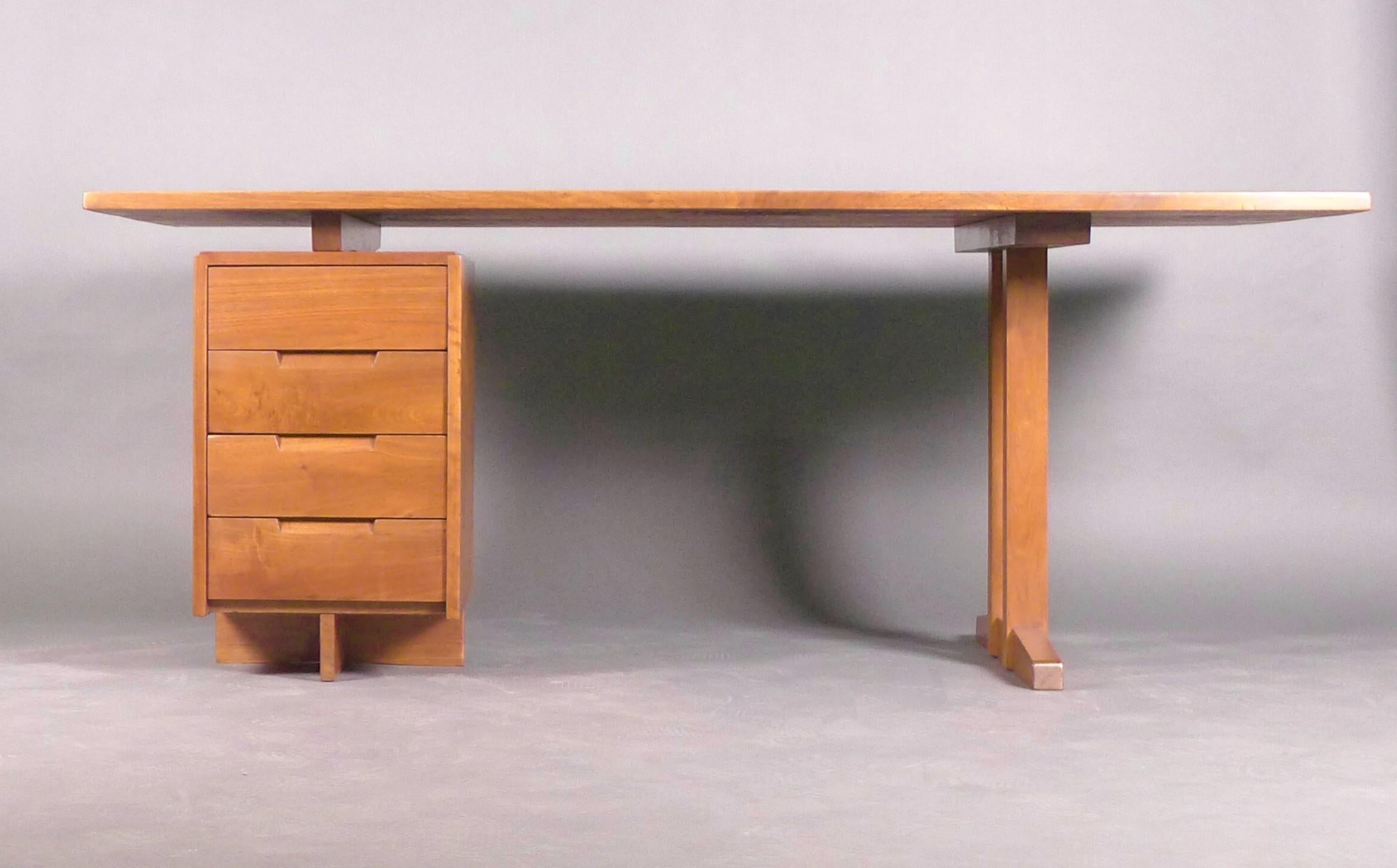 George Nakashima, Walnut Pedestal Desk with Free Edge, 1965

This beautiful and useful desk is in superb condition, the large top has a straight edge to the front and a freeform back edge, with single column of four drawers to the left and twin