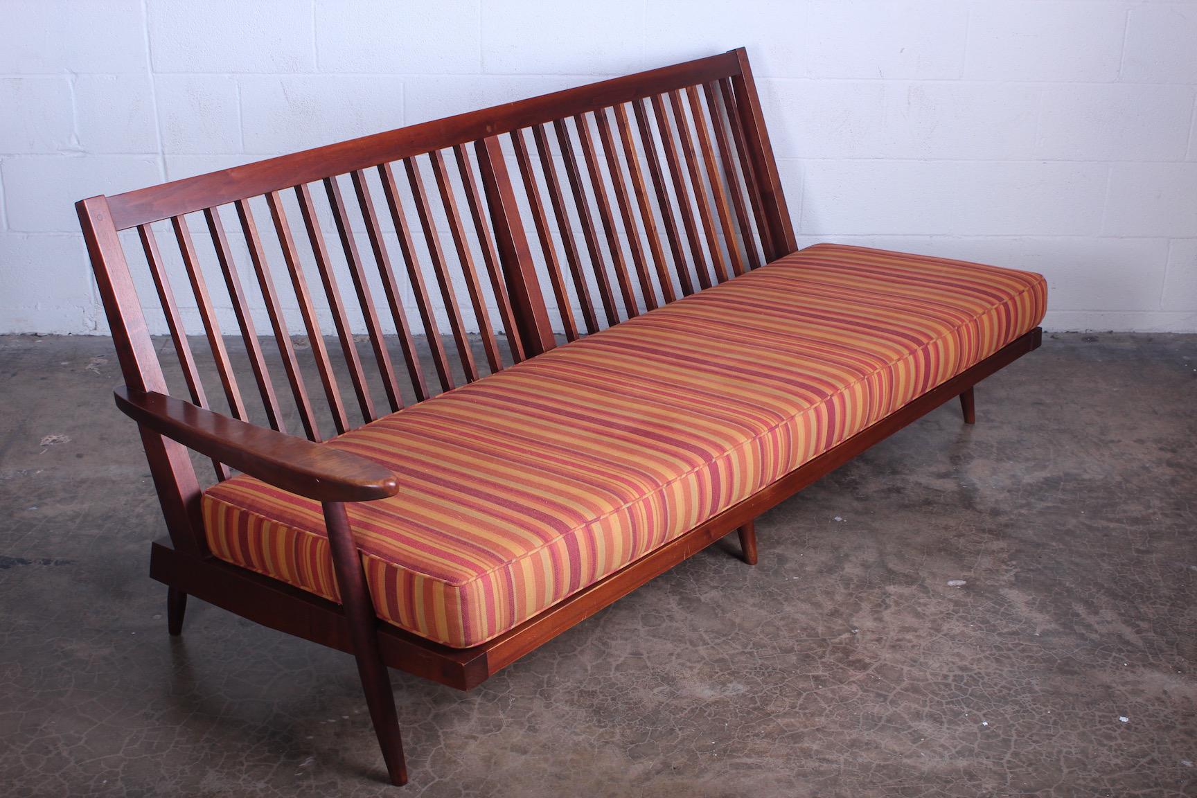 A walnut, one arm sofa by George Nakashima, 1961. Sold with a copy of the original receipt.
