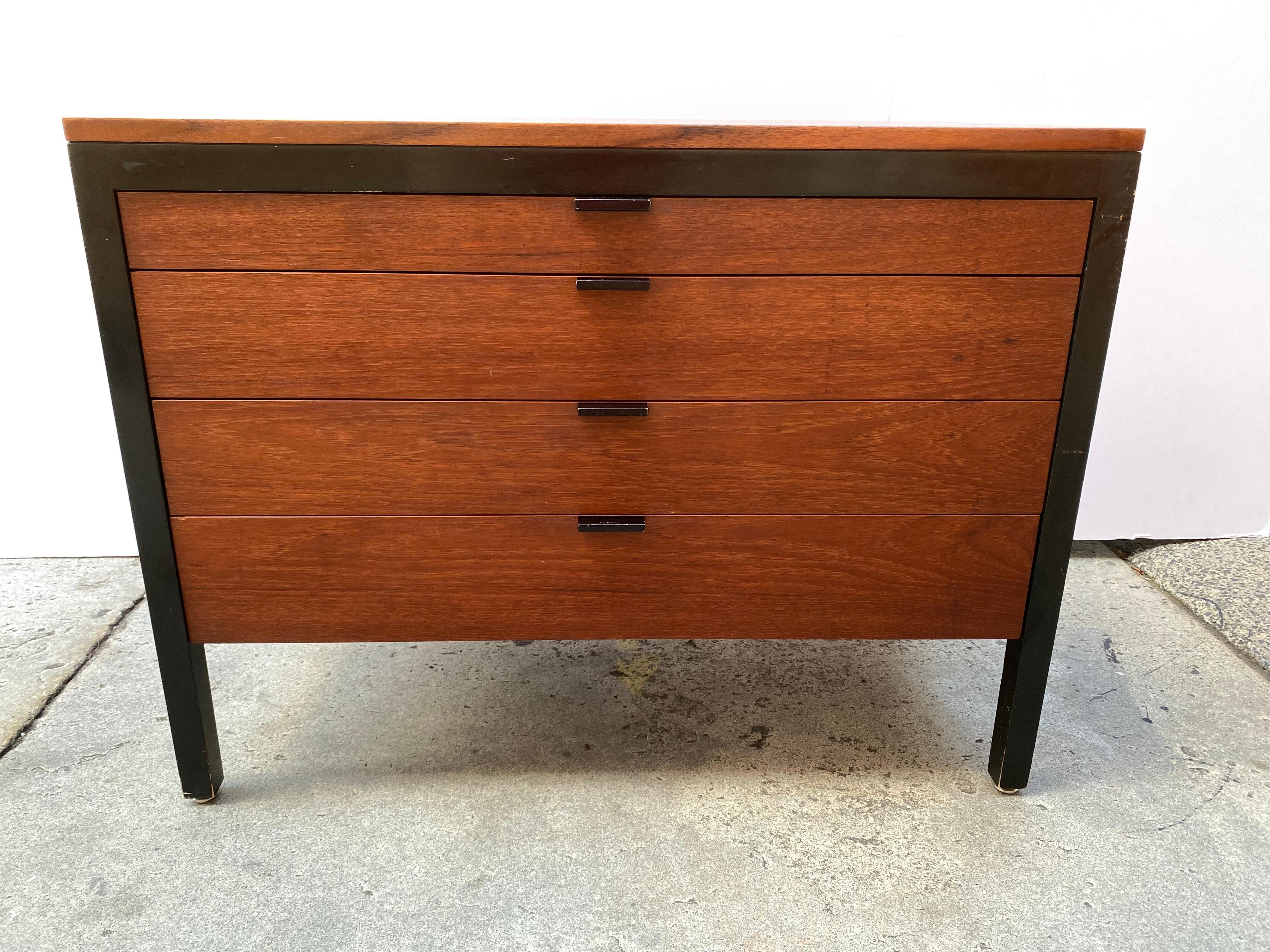 George Nelson for Herman Miller 4 drawer dresser from the late 1950's. Short lived series that has the feel of some of the Knoll Designs from the period. Walnut top and drawers with painted black legs. Divided drawers. Top has been refinished,