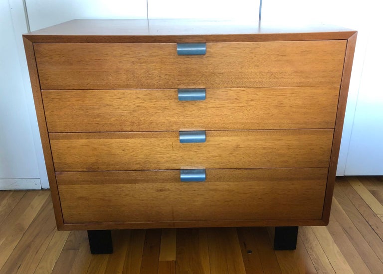 For Herman Miller, Primavera wood chest of drawers with ebonized wood legs and aluminum pulls, c. 1950. Retains aluminum foil manufacturers label.
 
