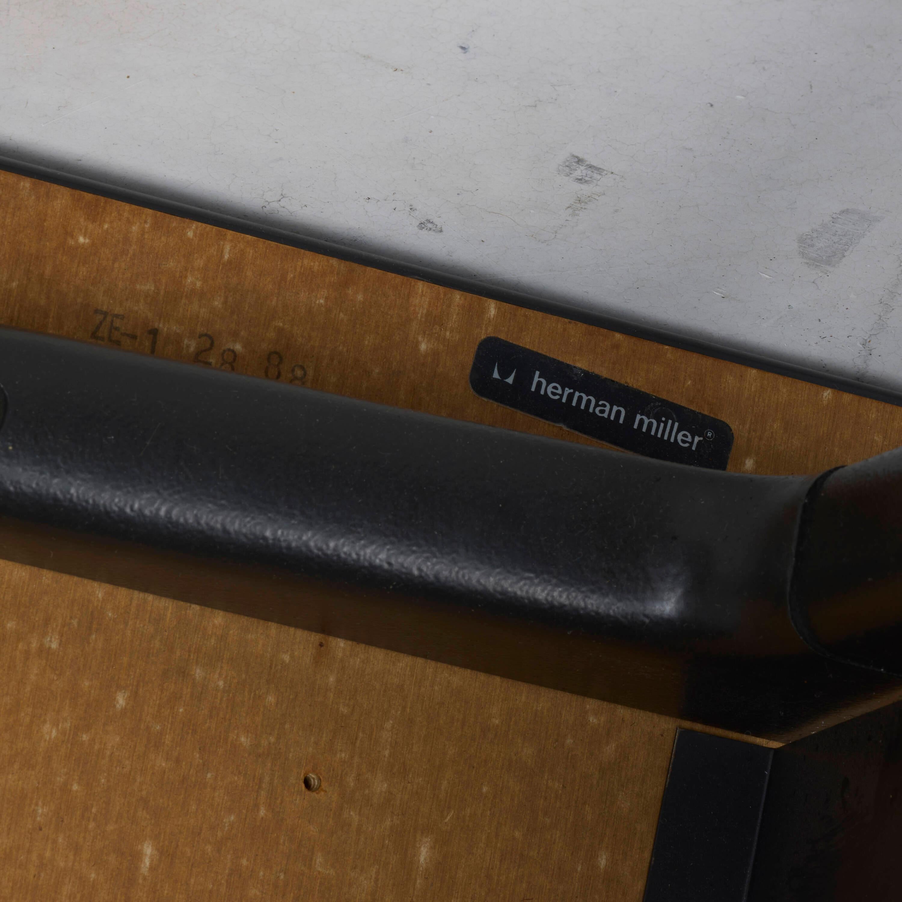 Good condition. Surfaces exhibit discolorations, scrapes, and scratches. Loss to the top right of one of the drawer handles, measuring approximately 3.25 x 1 inches, not affecting function.
