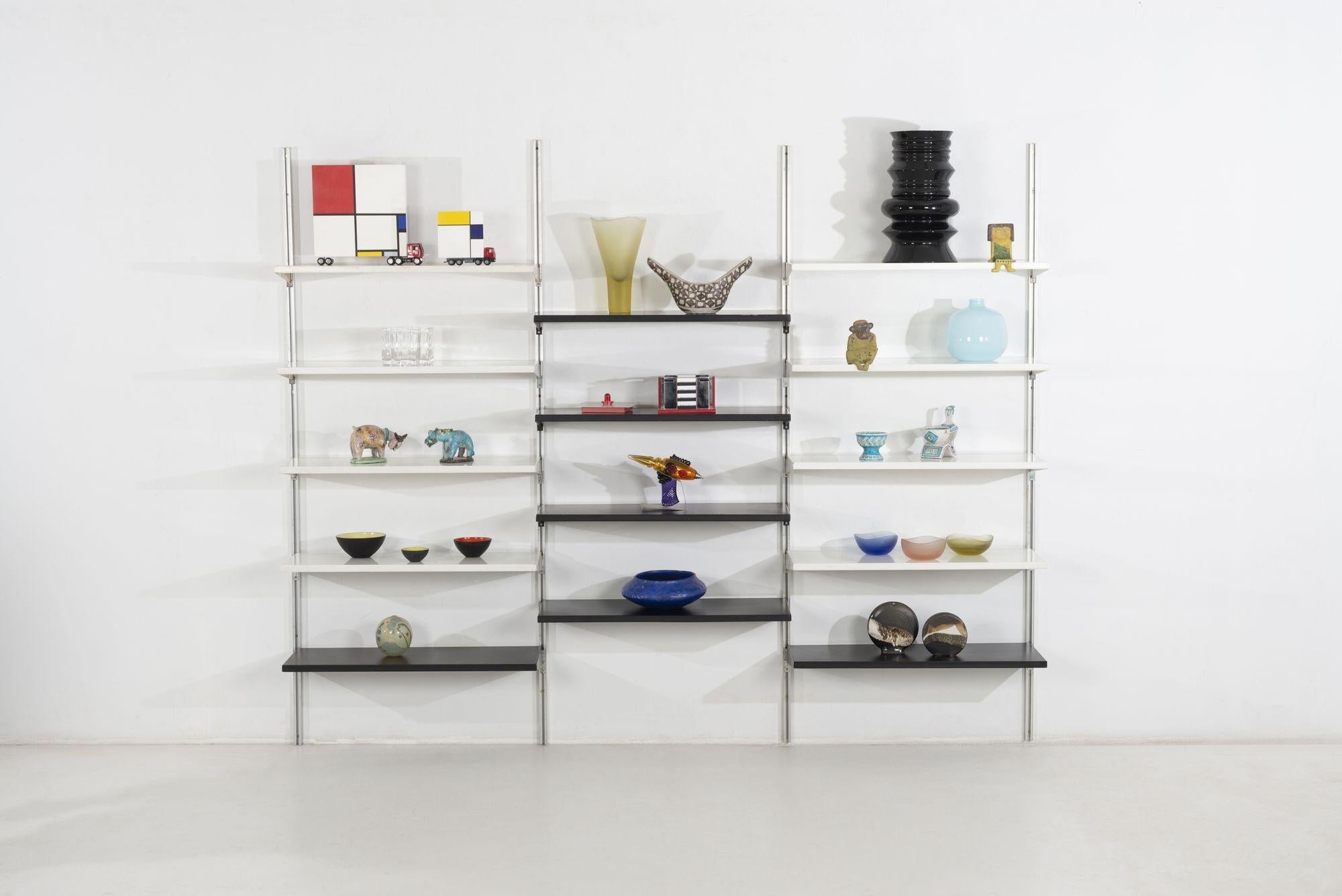 George Nelson & Associates CSS (Comprehensive Storage System)
System is comprised of Four uprights, with Fourteen metal adjustable shelves, Eight white and Six black.
