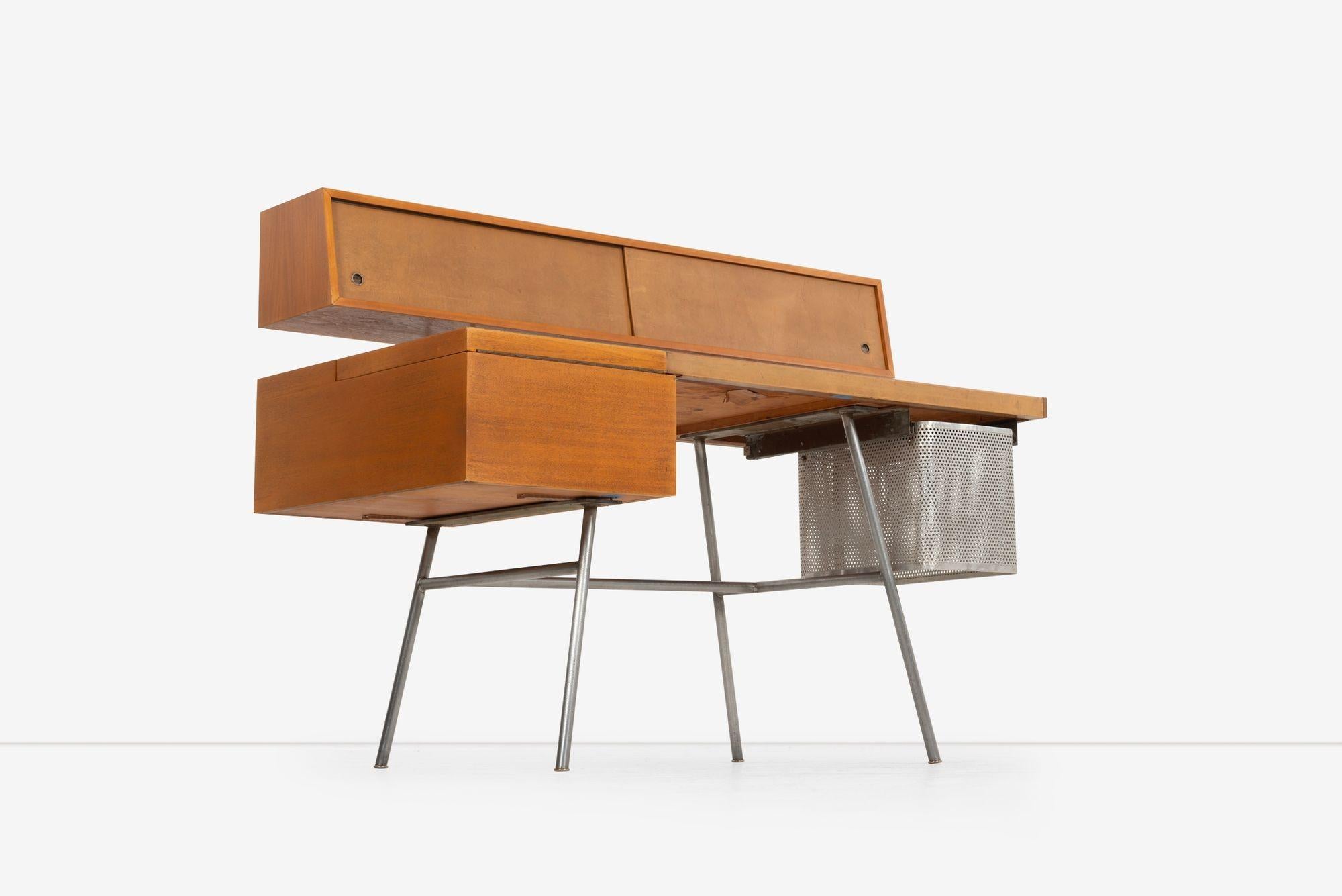 George Nelson & Associates for Herman Miller Home Office desk, 1946, model 4658 
Desk features flip-top compartment revealing small organizer, two doors concealing three fixed shelves and letter storage, and a perforated aluminum slide-out file