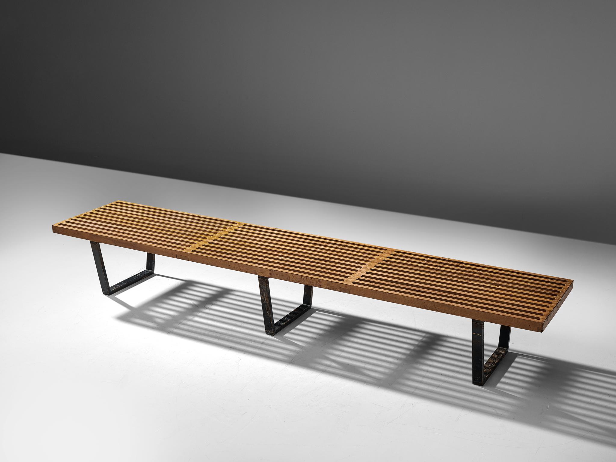 George Nelson & Associates for Herman Miller, slat bench model 4492, birch and lacquered wood, United States, 1946.

The Slat Bench was part of the first collection that George Nelson designed for Herman Miller.The top was formed by an open grid of