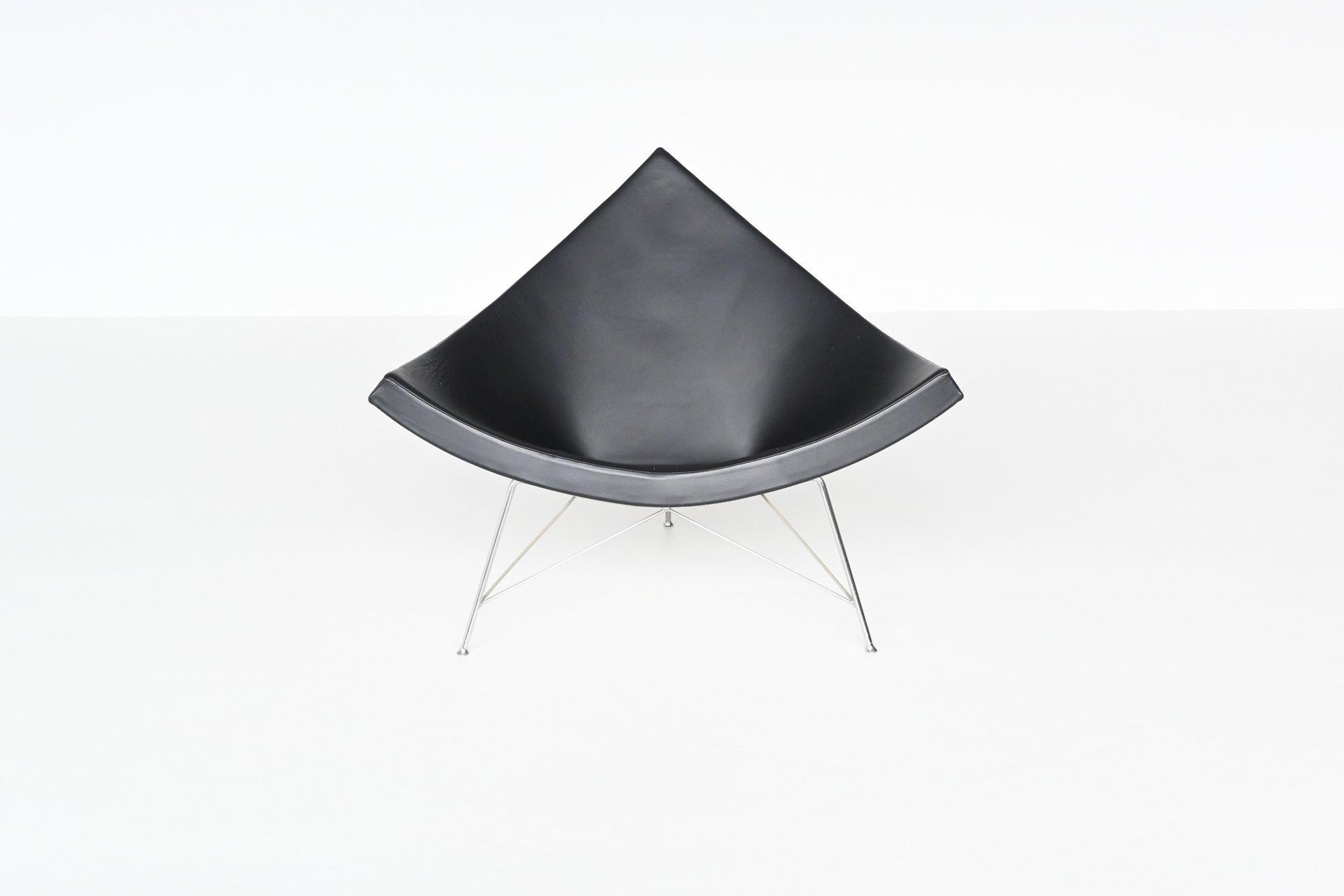 Iconic model Coconut lounge chair designed by George Nelson and manufactured by Vitra, United States 1955. This beautiful shaped chair consists of a triangular fiberglass shell which rests on an architectural brushed-steel tripod base. The seat
