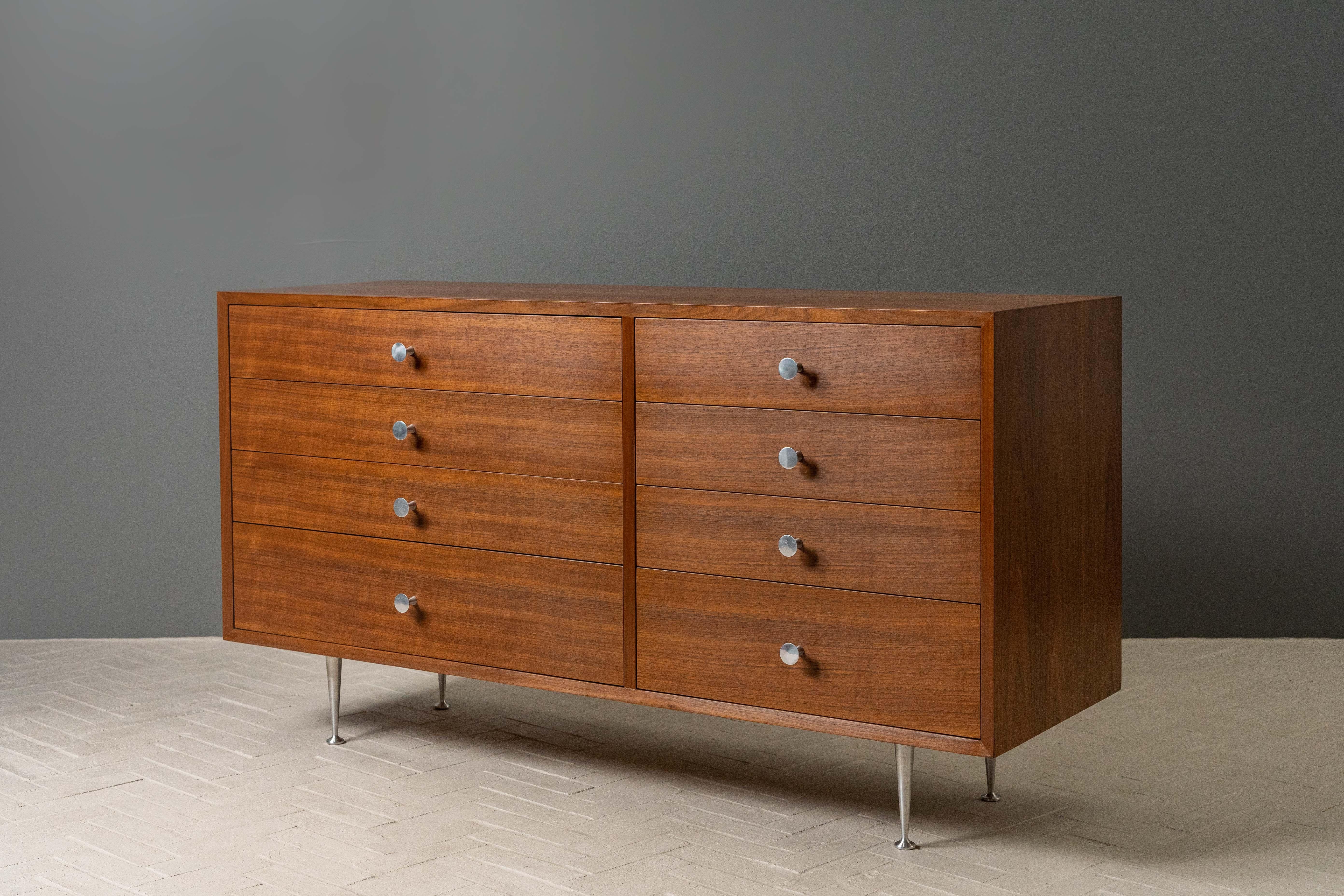 USA, ca. 1950s. A stunning bureau or double chest by George Nelson for Herman Miller. Features walnut construction with two rows of four drawers. Slightly asymmetrical drawer configuration adds interest and increases functionality. Finished with