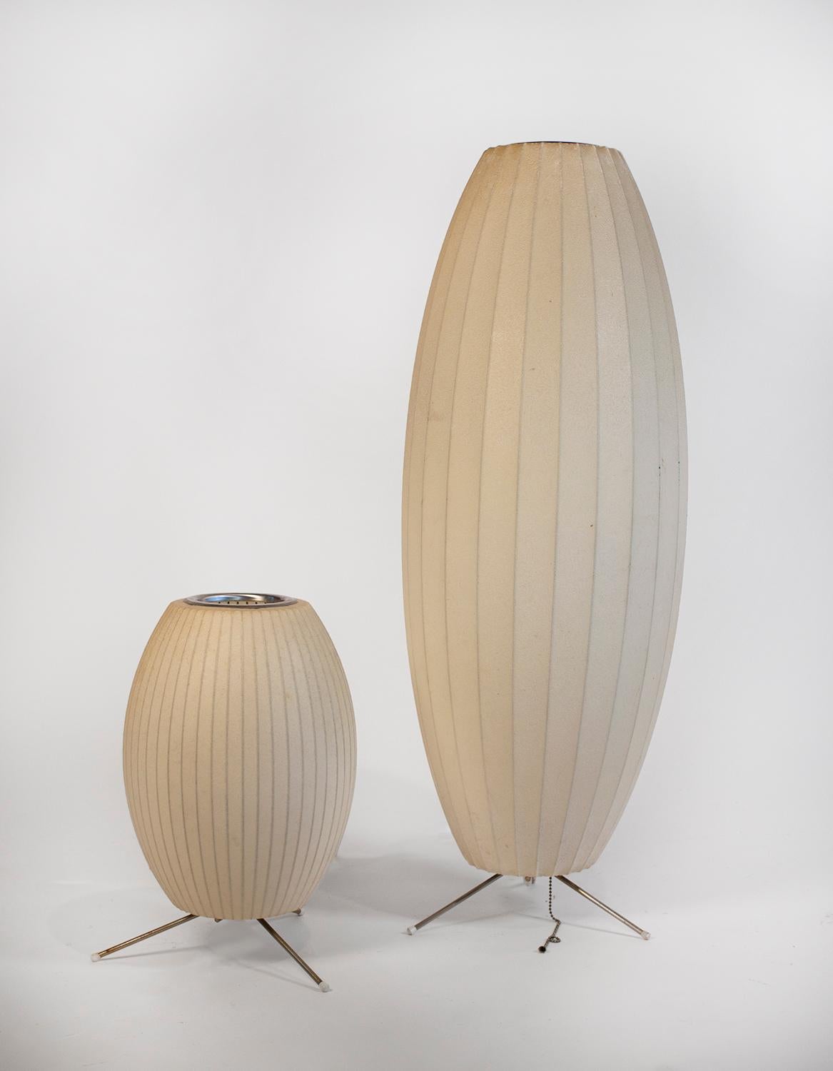 Pair of George Nelson designed bubble lamps for Howard Miller.

Both are original tabletop models from the 1960s with the tripod base.
Acquired from an architect's estate.
Original feet intact.

Measures: Small lamp: 16