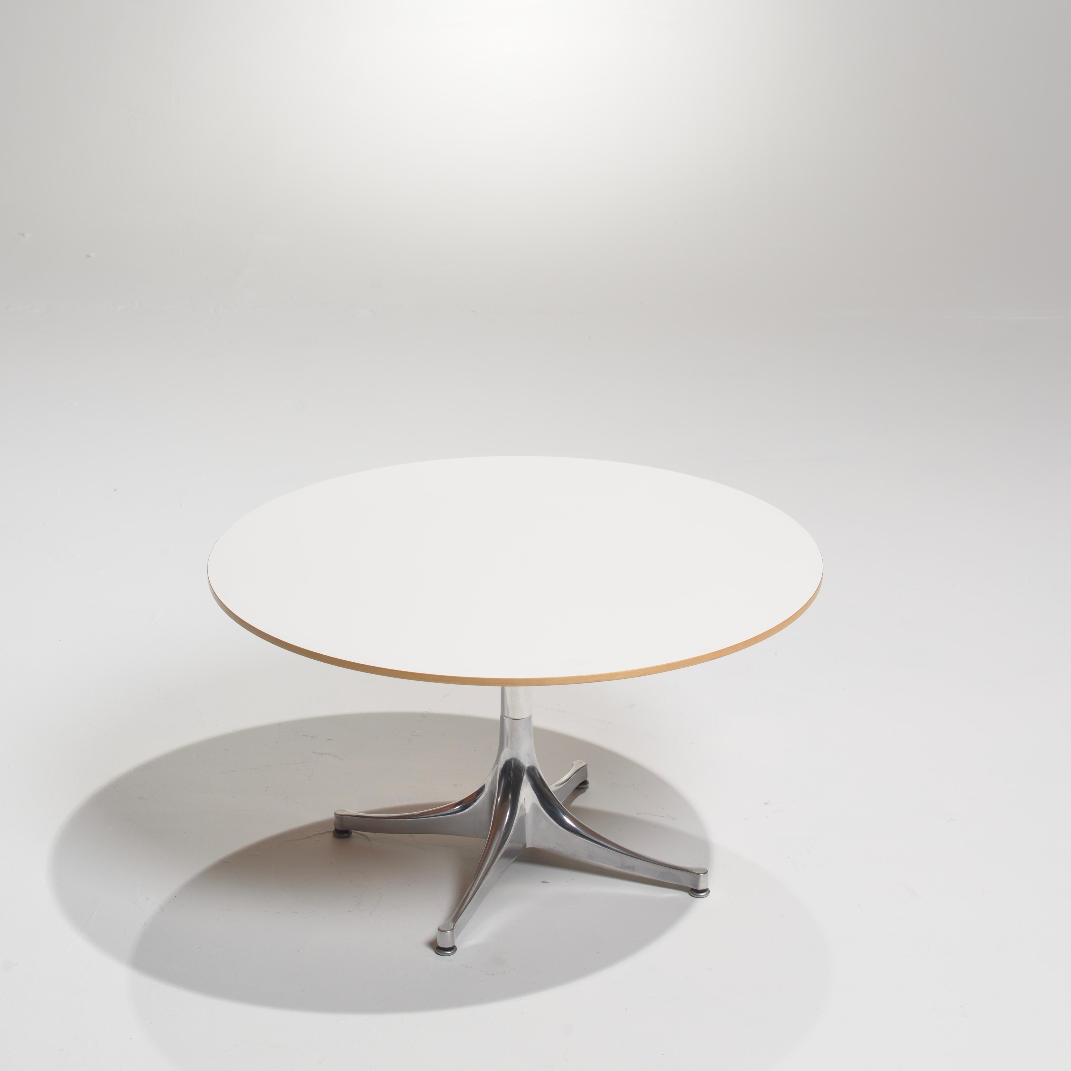 This is George Nelson's signature end table, characterized by clean lines and practicality. The metal base pedestal looks almost organic as it rises from the floor. First produced in 1954, this version of his end table is 16
