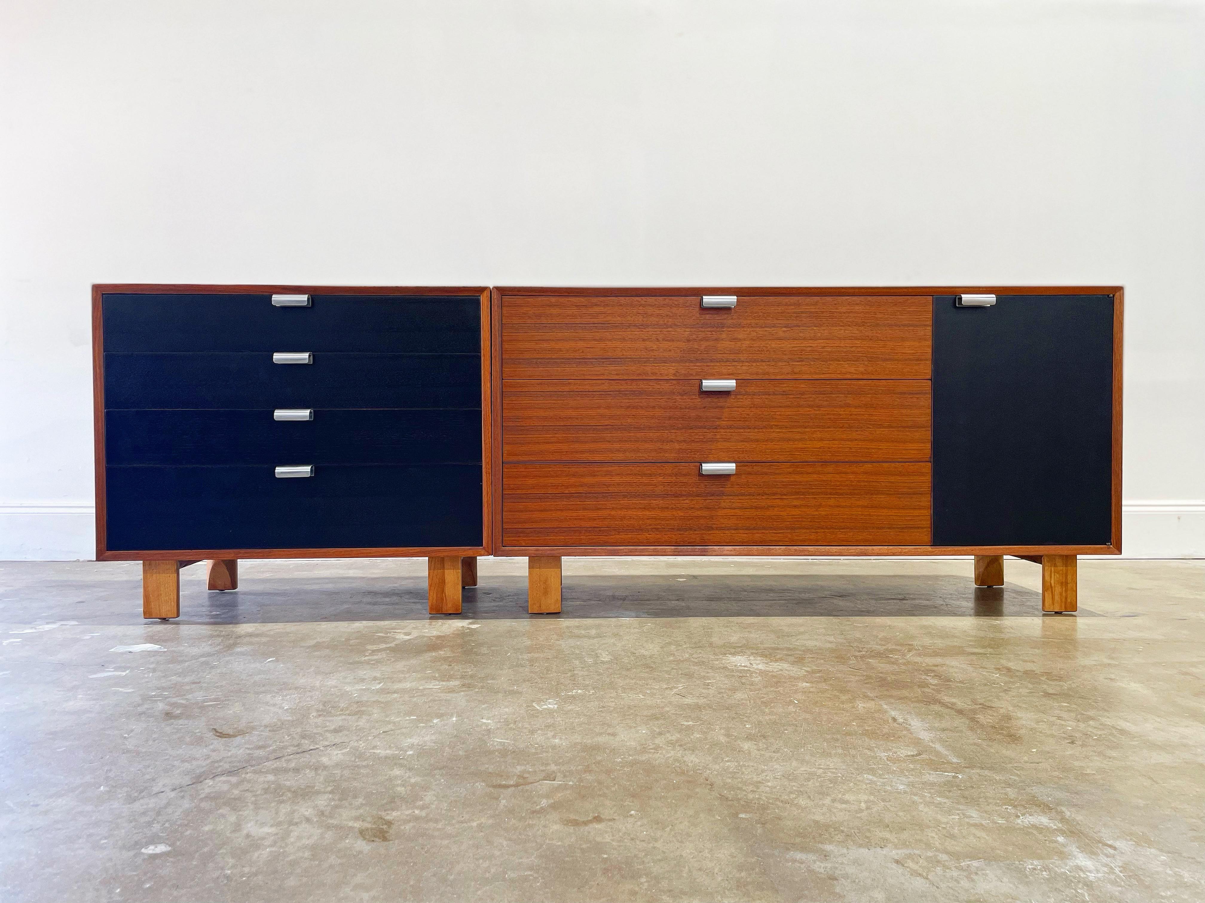 George Nelson for Herman Miller Mid-Century Modern credenza, circa 1950s. Basic cabinet series with Walnut wood cases and drawers, black lacquered cabinet door and drawers, aluminum pulls and sculpted Primavera wood base legs. Two adjustable height