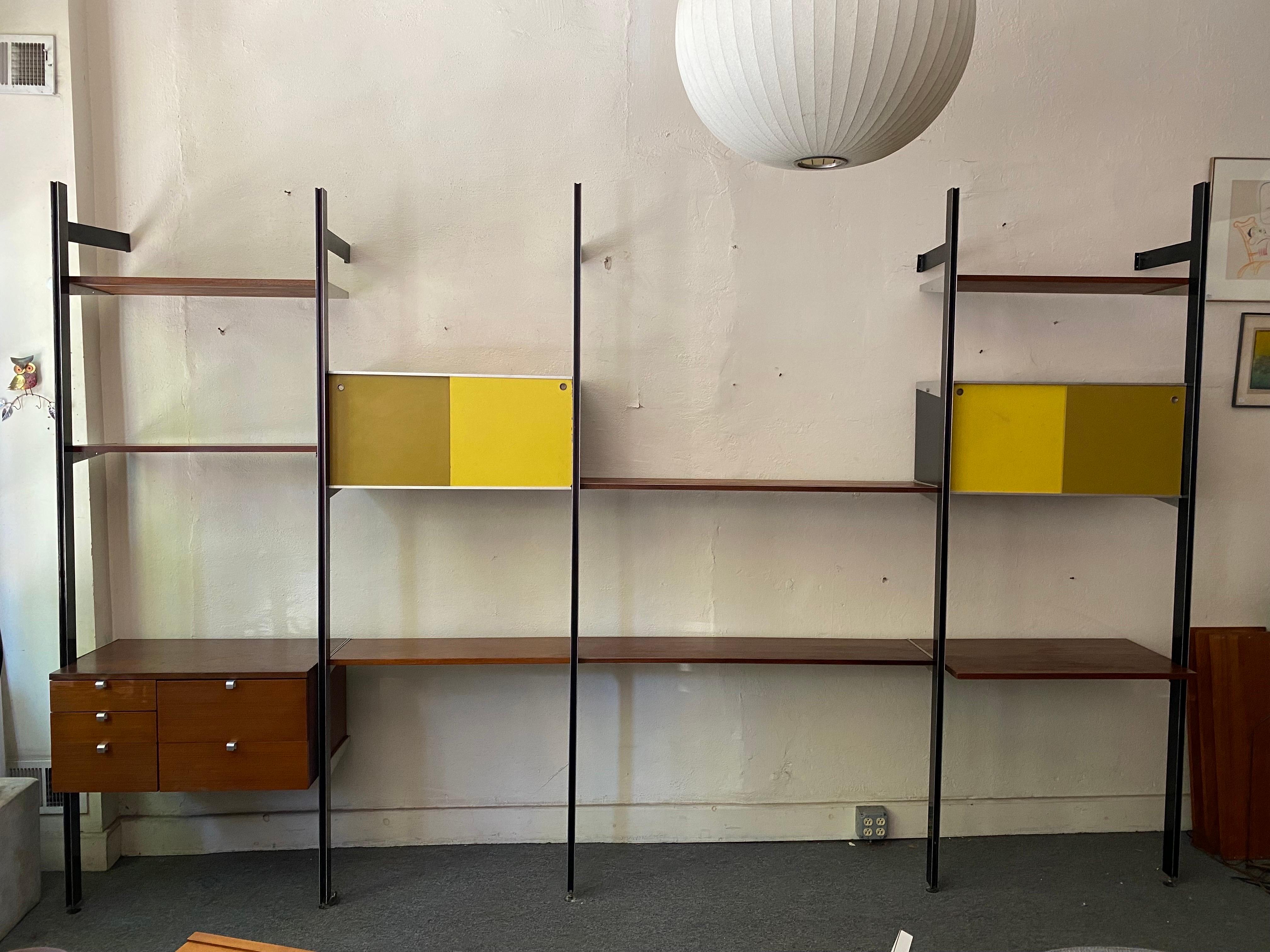 George Nelson Comprehensive Storage System CSS for Herman Miller Furniture. Such a useful and Great Design! All the weight hangs from the front poles so always an amazing sturdy Unit! Set consists of:

1 Cabinet with pull out drawer for