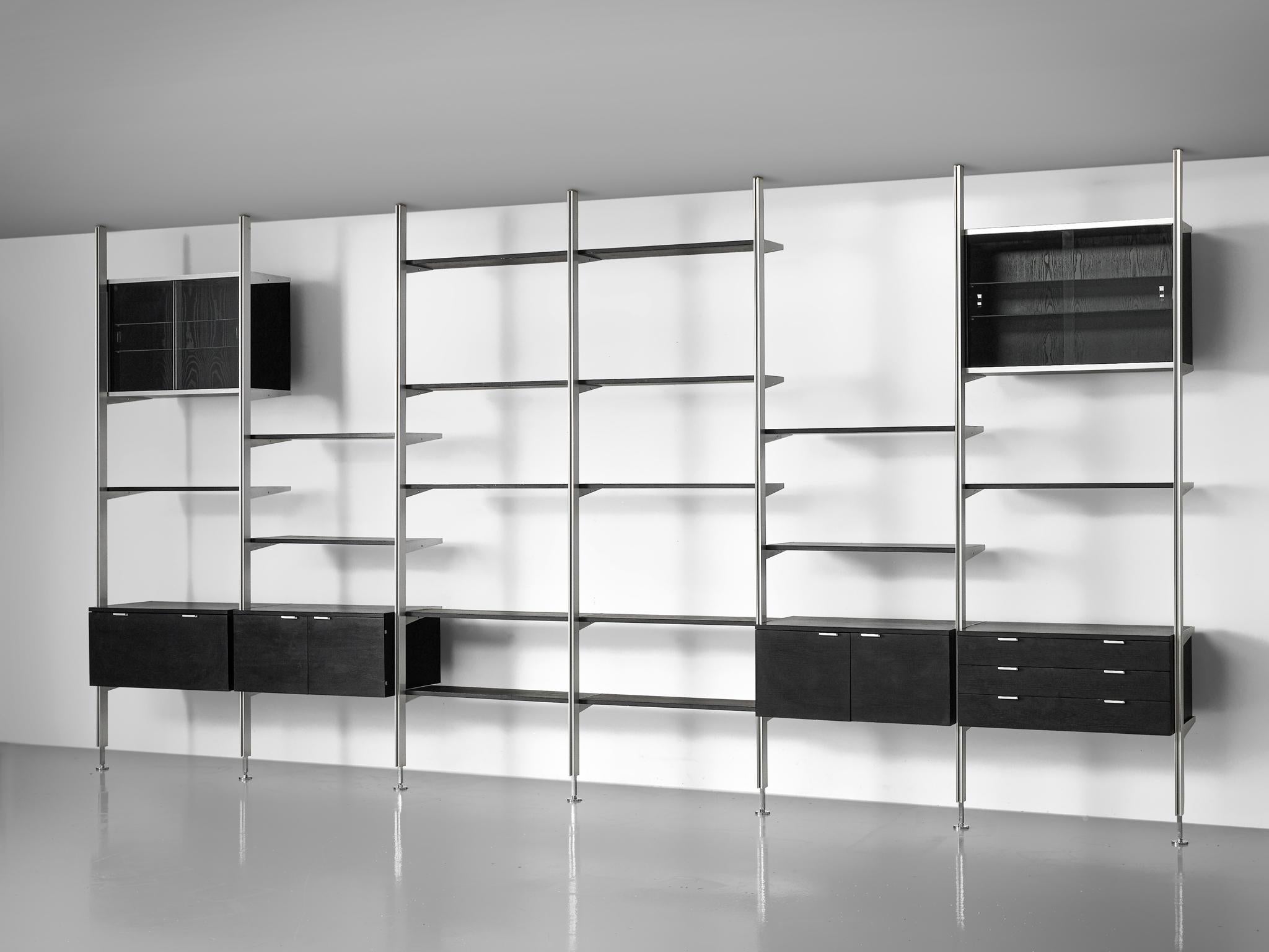 George Nelson, 'CSS' wall unit, brushed steel, glass and wood, United States, 1960s

This very large storage system is designed by Nelson in the 1960s. The wall unit was the first piece of furniture by Miller that made use of vertical space to