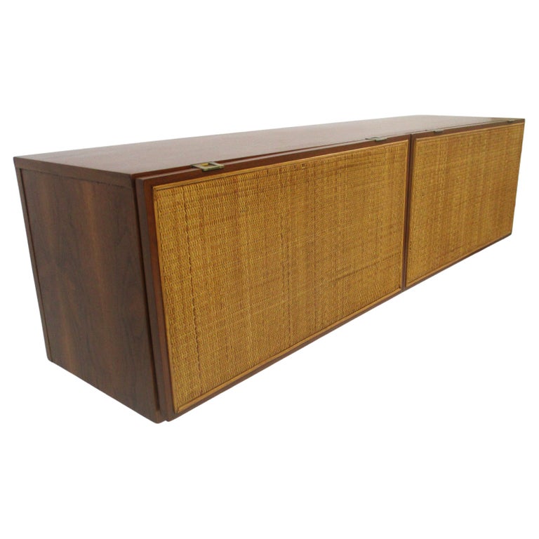 A Pair of Walnut Cabinets with Cane Fronted Sliding Doors A Pair of Walnut Cabinets with Cane Fronted Sliding Doors