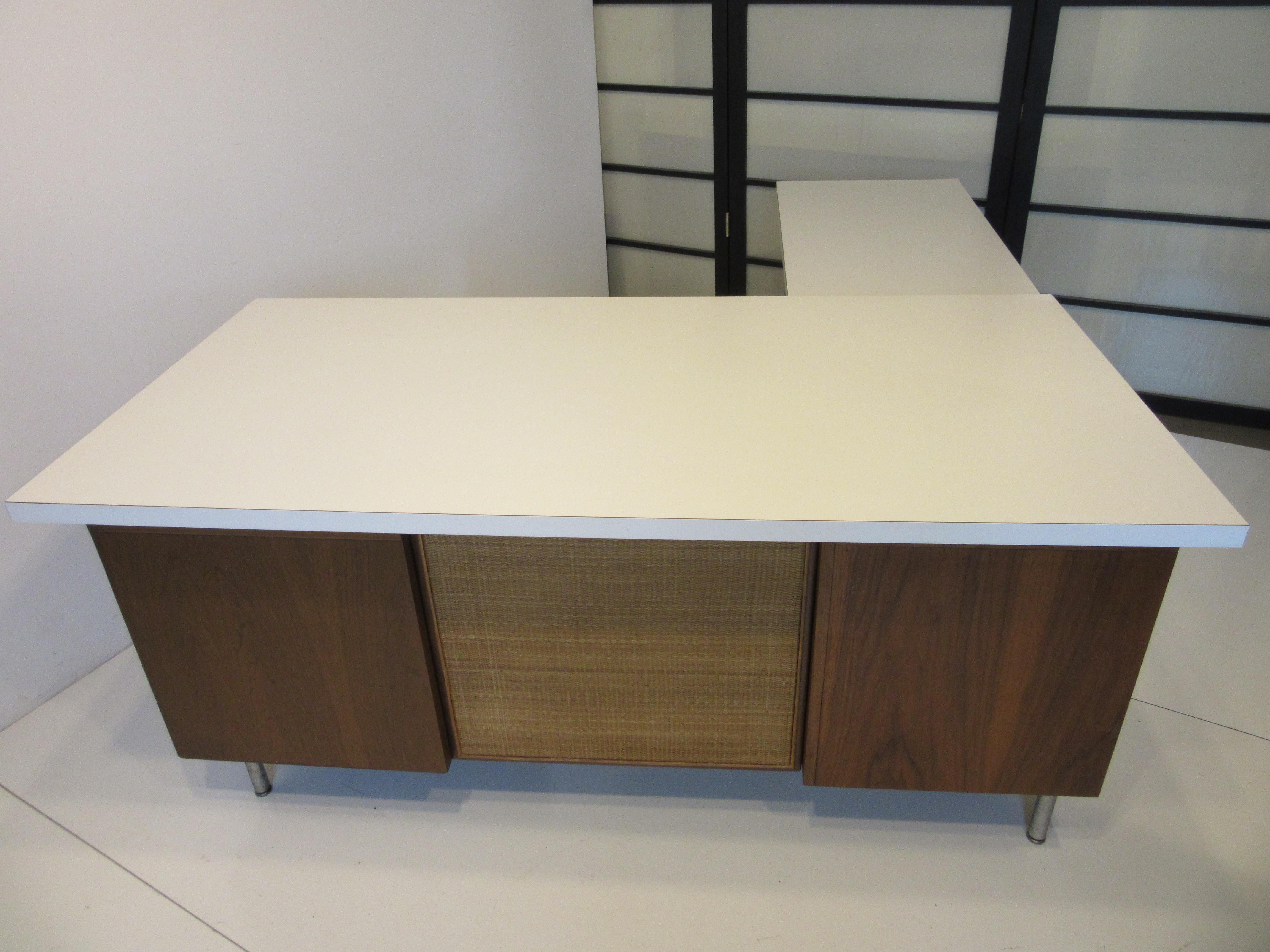 A Nelson desk from a Eero Saarinen designed building which was designated a National Historic landmark by the National park Service in Columbus Indiana. The furnishings for the building were custom ordered by Nelson who designed the interior with