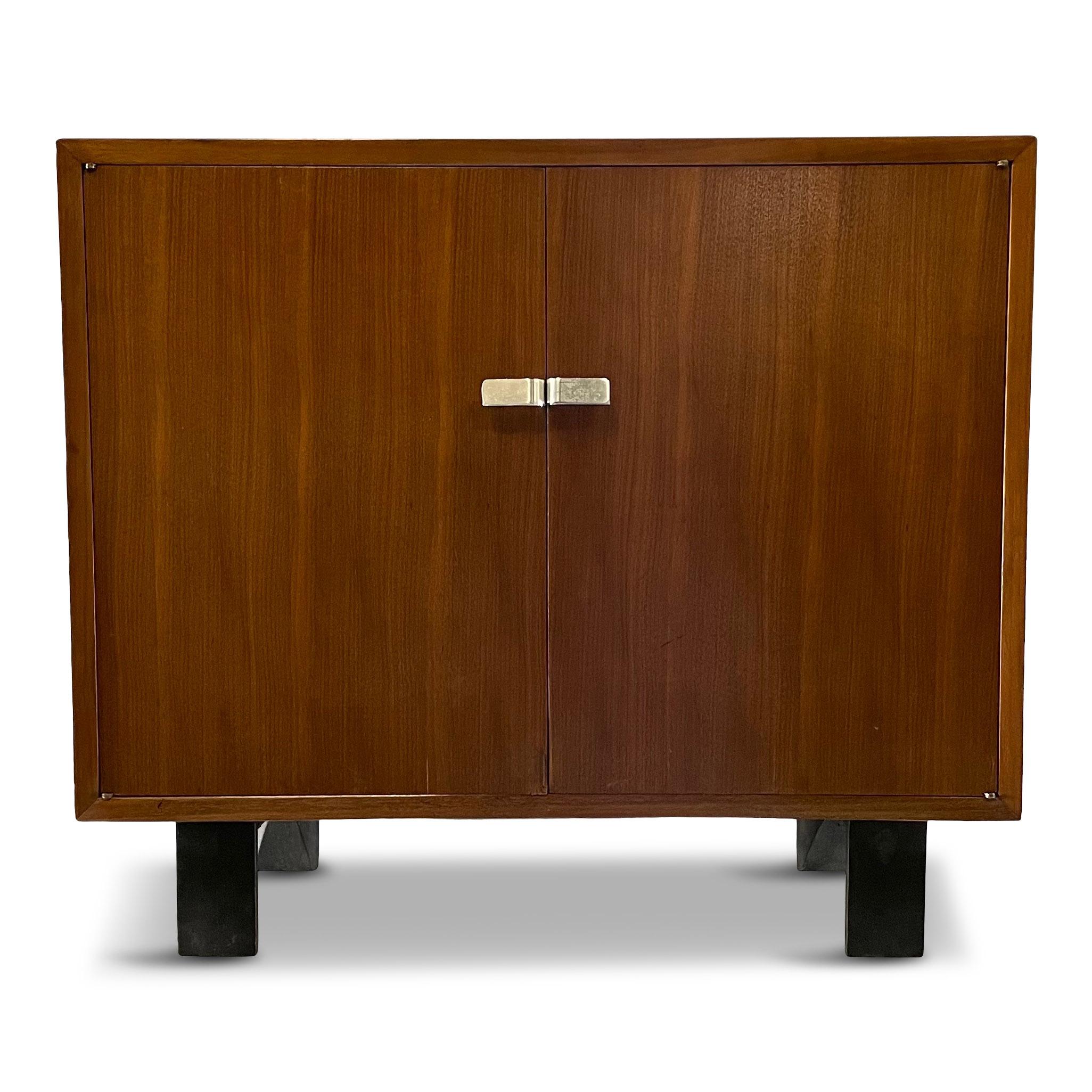 Very early cabinet designed by George Nelson for Herman Miller. This cabinet has unusual silver pulls.