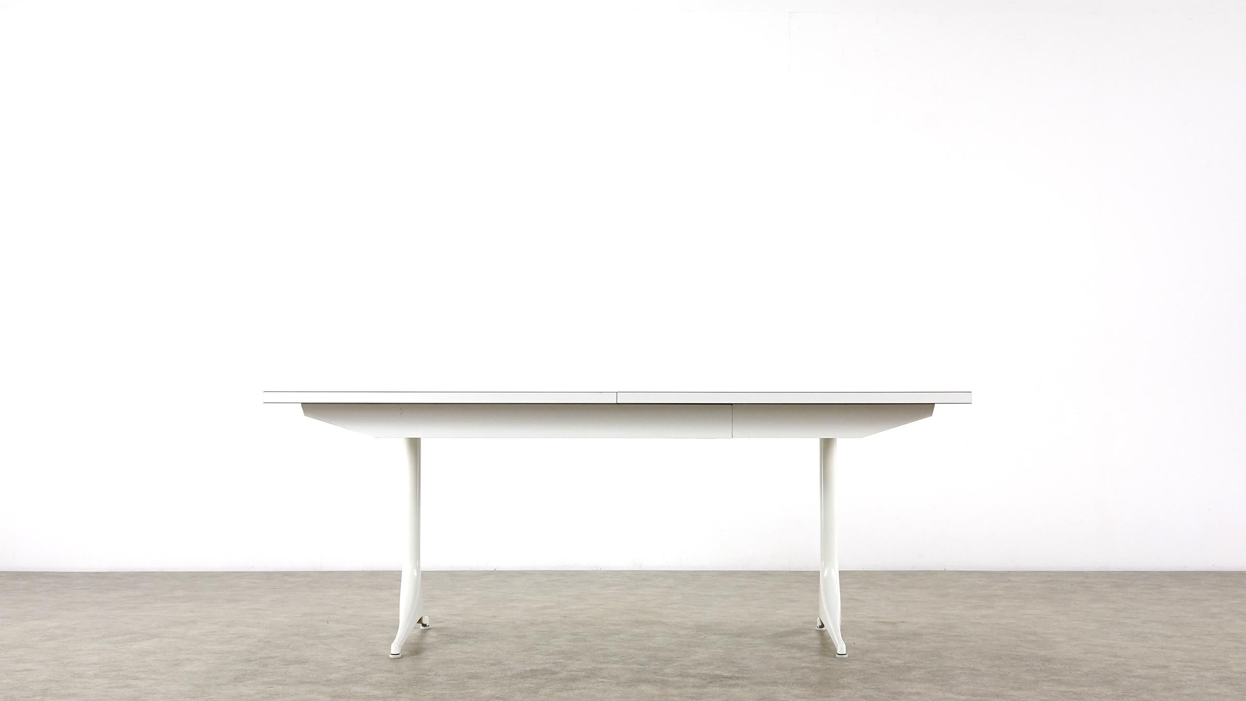 The table is extendable to 235 and 286.5 cm in width. In a good original vintage condition, preserving a patina.

A dining table designed by George Nelson, manufactured by Herman Miller in the USA, circa 1960. The table is made from white coated