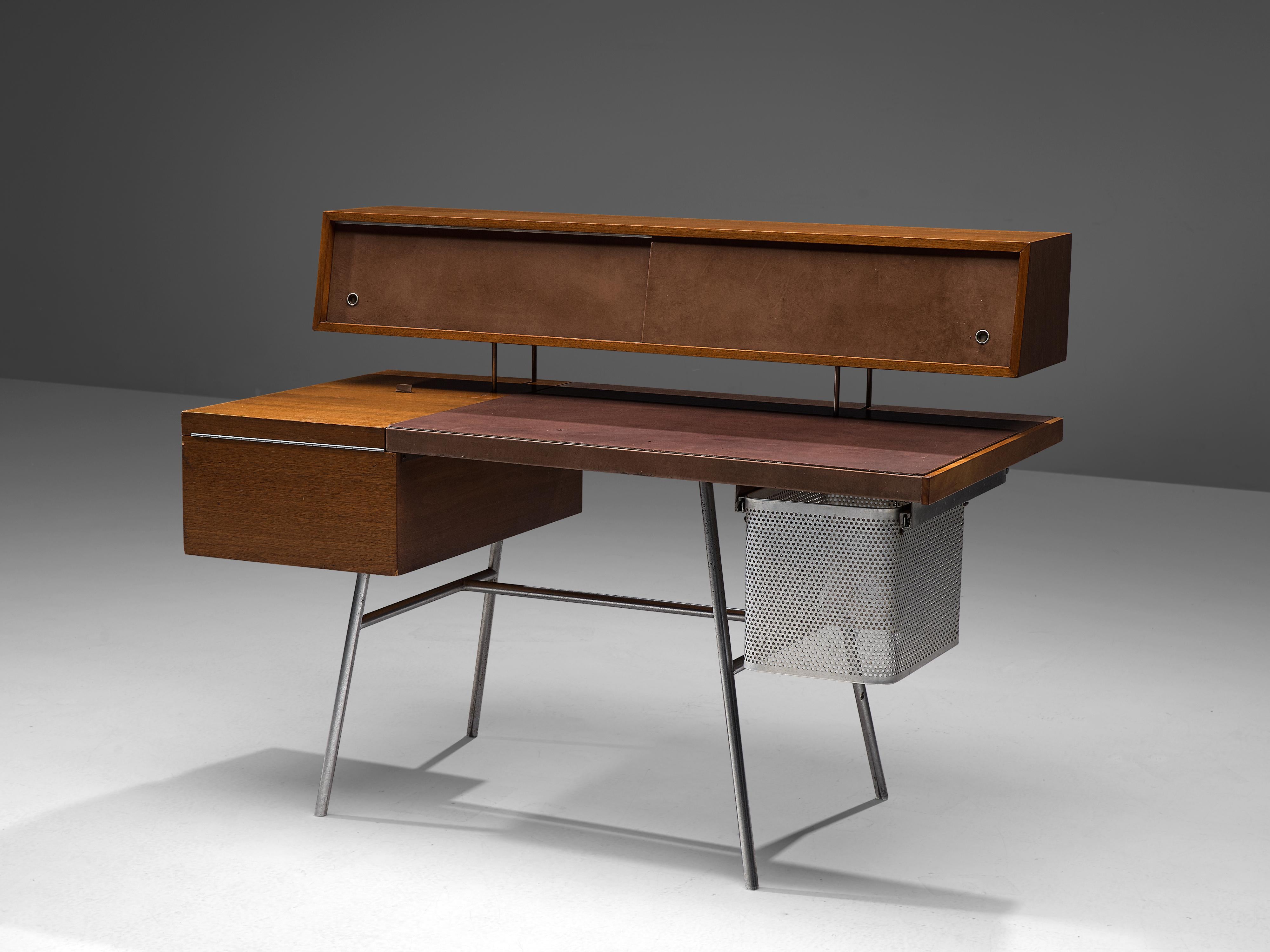 George Nelson for Herman Miller, desk n. 4658, walnut, steel, leather, United States, 1946

Made of walnut with original brown leather writing surface and sliding doors, resting on a base in steel, the desk 4658 does not only convinces through his