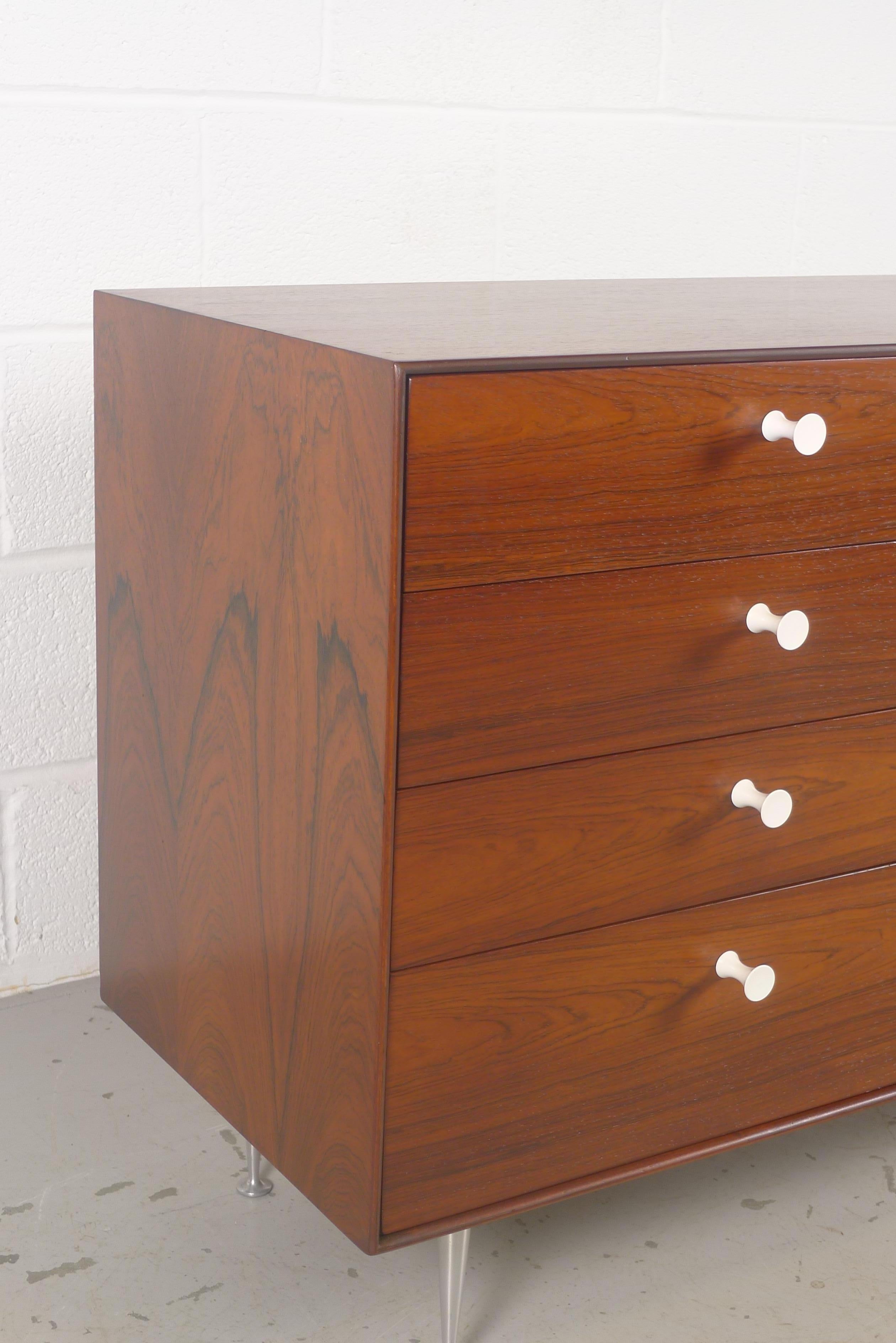 George Nelson for Herman Miller, USA, Thin Edge dresser model 5221 designed in 1952. This original example in bookmatched rosewood veneers produced in the 1950s 
8 drawers with original foil label top left. 
Excellent condition.
Provenance; From