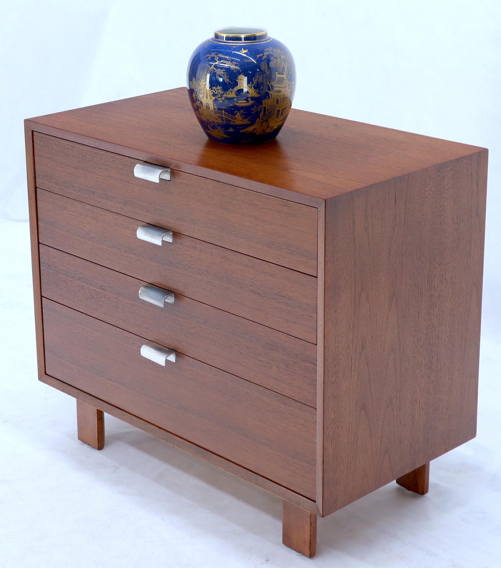 Mid-Century Modern walnut four drawers bachelor chest dresser cabinet designed by George Nelson for Herman Miller.
 
