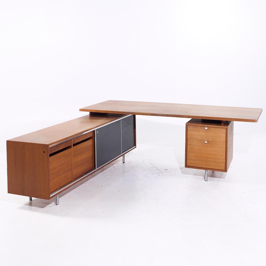 George Nelson for Herman Miller 9000 Series Mid Century Walnut Desk and Return

This desk measures: 84 wide x 36 deep x 30 high, with a chair clearance of 28.75 inches
The return measures: 84 wide x 86 deep x 30 inches high

All pieces of furniture
