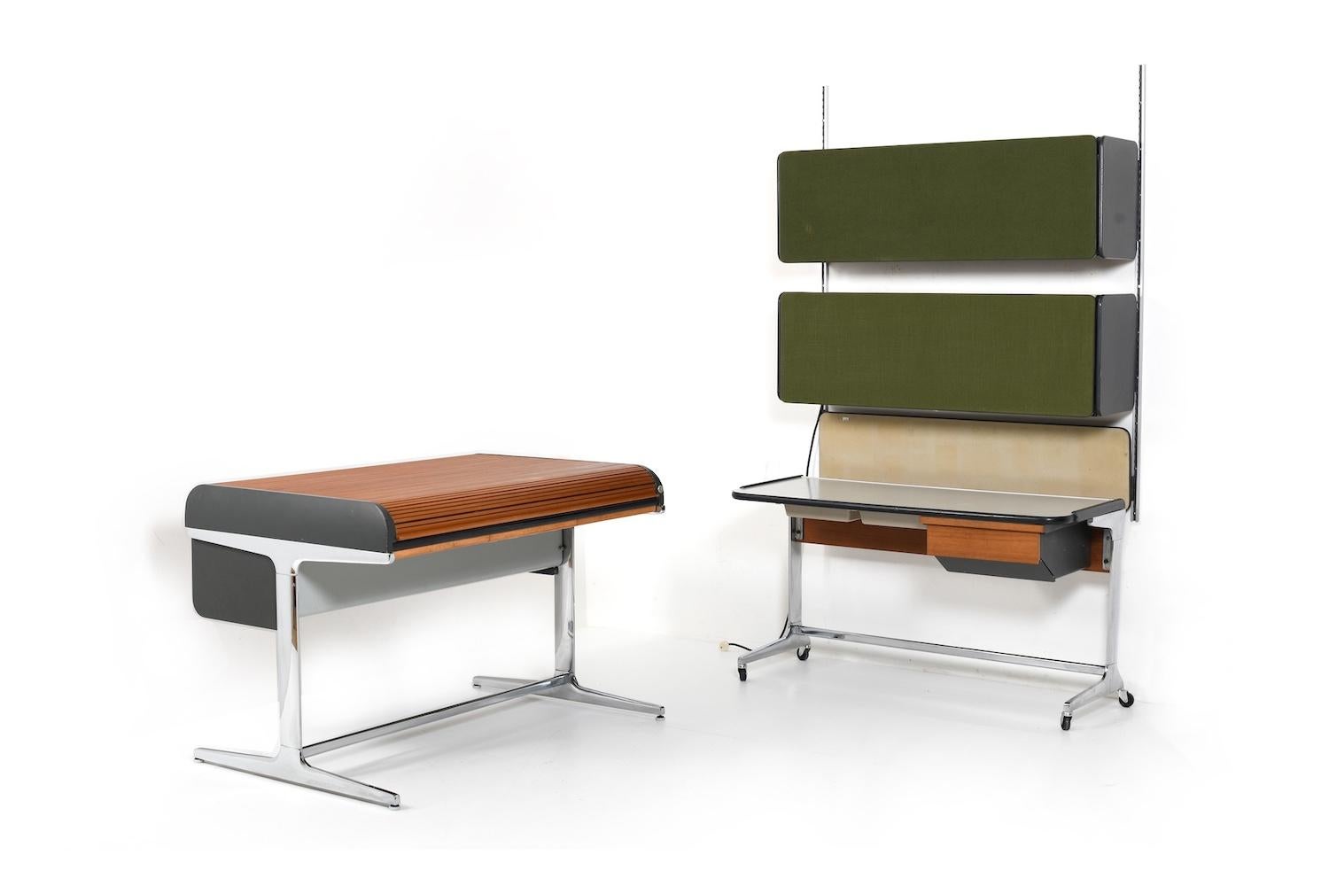 Action office set by George Nelson for Herman Miller. Designed in 1965-67. This set consists of a large desk with a roll-top in massive teak, a small desk on wheels, and a wall set with 2 containers and a pinboard. The fronts of the wall containers