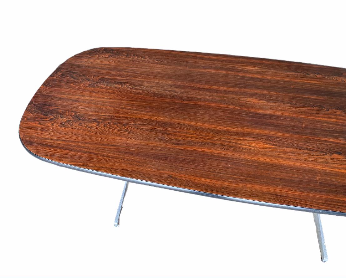 Gorgeous and sharp George Nelson Brazilian rosewood table. Part of Nelson’s action office series for Herman Miller, this piece is suitable for a boardroom as a conference table or corner office as an Executive desk. The use of rosewood also softens