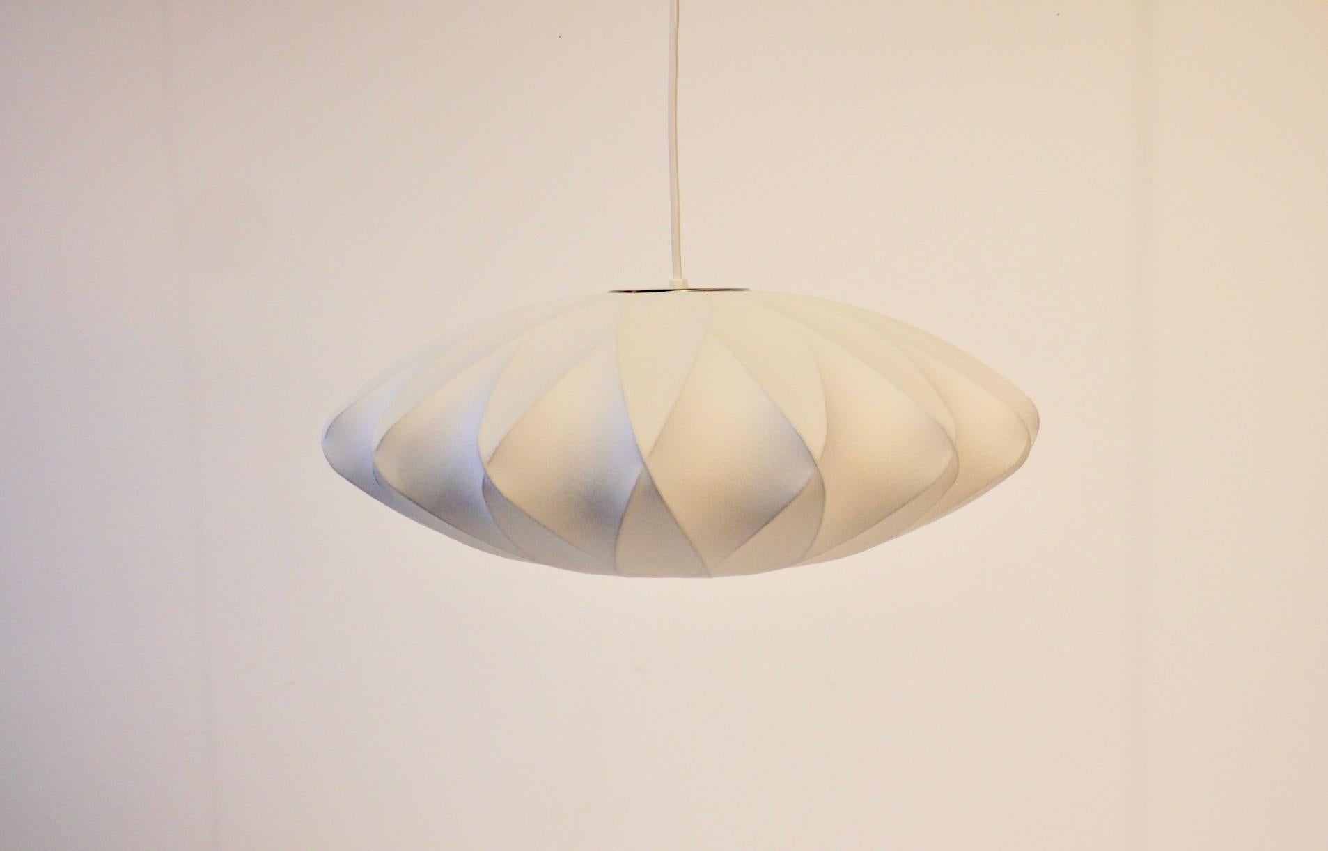 George Nelson criss cross flying saucer hanging bubble lamp. Distributed by Herman Miller. As new condition