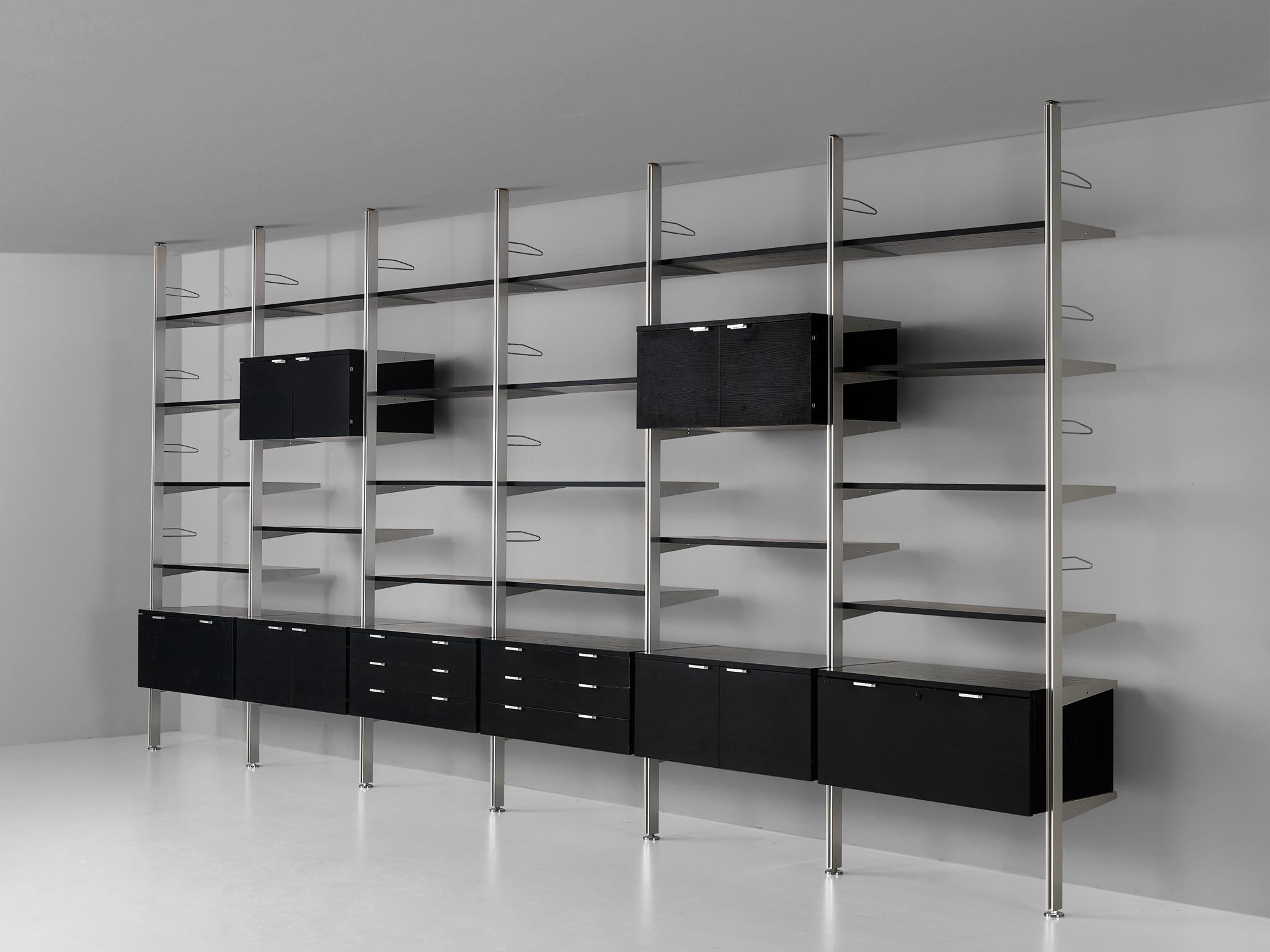George Nelson for Herman Miller, 'CSS' wall unit, brushed steel, lacquered oak , United States, 1960s 

This very large storage system is designed by George Nelson in the 1960s. The wall unit was the first piece of furniture by Herman Miller that