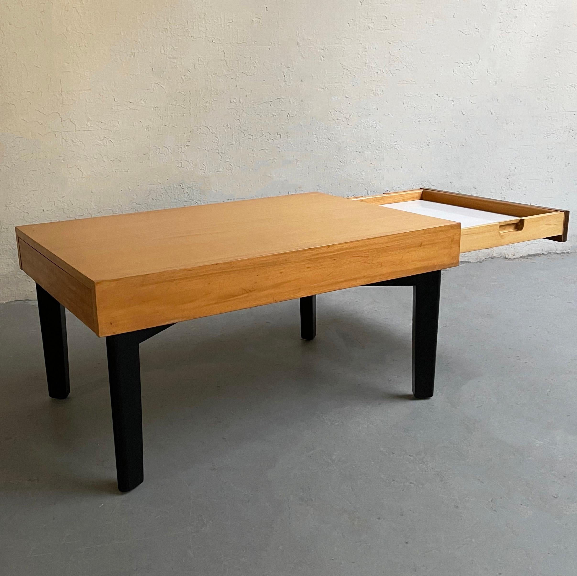 Mid-Century Modern, model 4652, Primavera coffee table by George Nelson for Herman Miller pulls out on each end as an extension of surface or to reveal two stored removable trays 21 x 16 inches with white formica tops. The table top is natural white