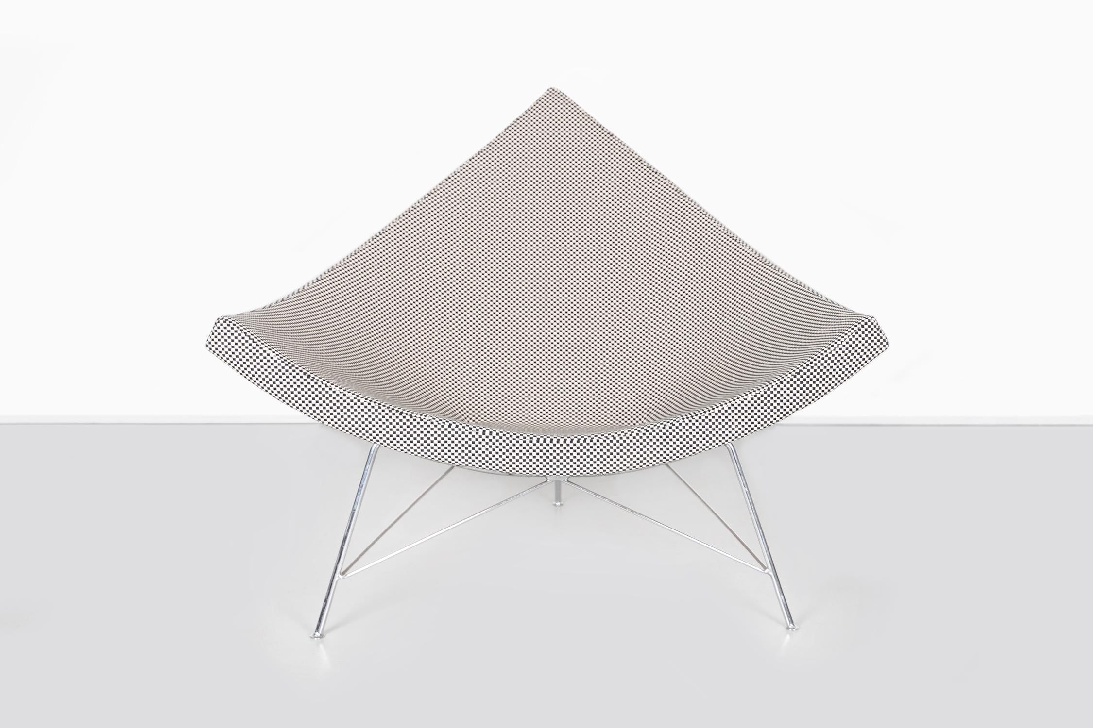 Coconut chair

Designed by George Nelson for Herman Miller

USA, circa 1950s

1950s Alexander Girard “Minicheck” fabric, fiberglass, and aluminum

Measures: 33” H x 41 ½ W x 34” D x seat 13 ¾” H

This first edition chair has been