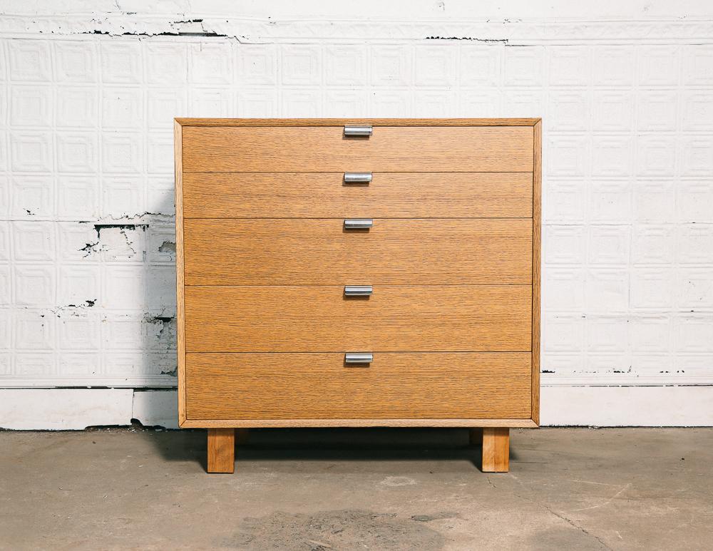 Five drawer dresser designed by George Nelson for the Herman Miller Primavera line.

Beautifully restored blonde wood with metal pulls.