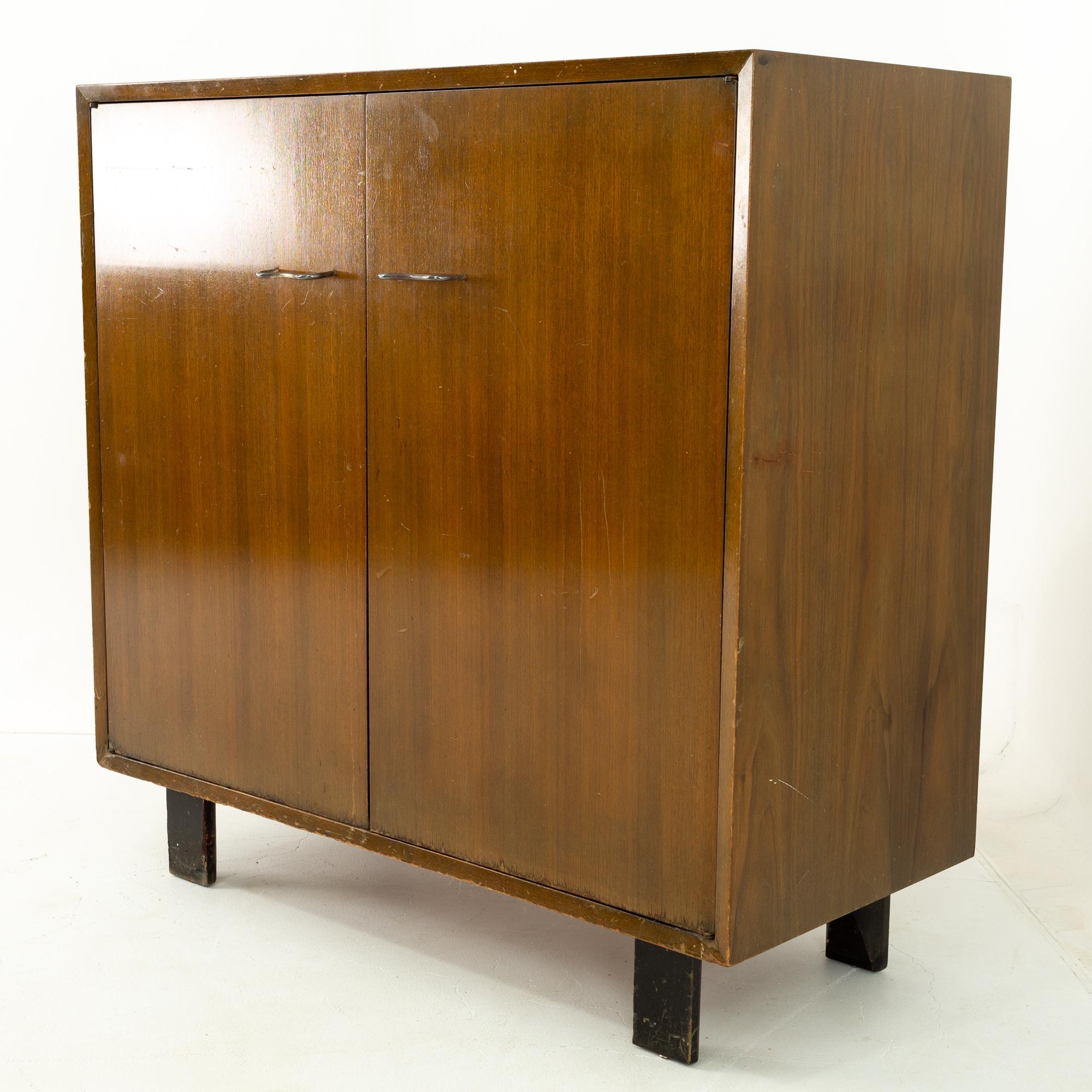 George Nelson for Herman Miller mid century 2 door media cabinet
Media cabinet is: 40 wide x 18.5 deep x 39.5 high

All pieces of furniture can be had in what we call restored vintage condition. That means the piece is restored upon purchase so