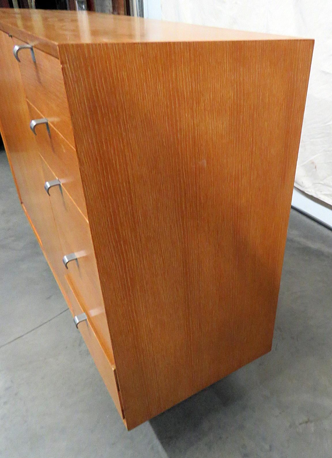 George Nelson for Herman Miller Mid-Century Modern cabinet with 2 doors containing 2 shelves and 5 additional drawers.